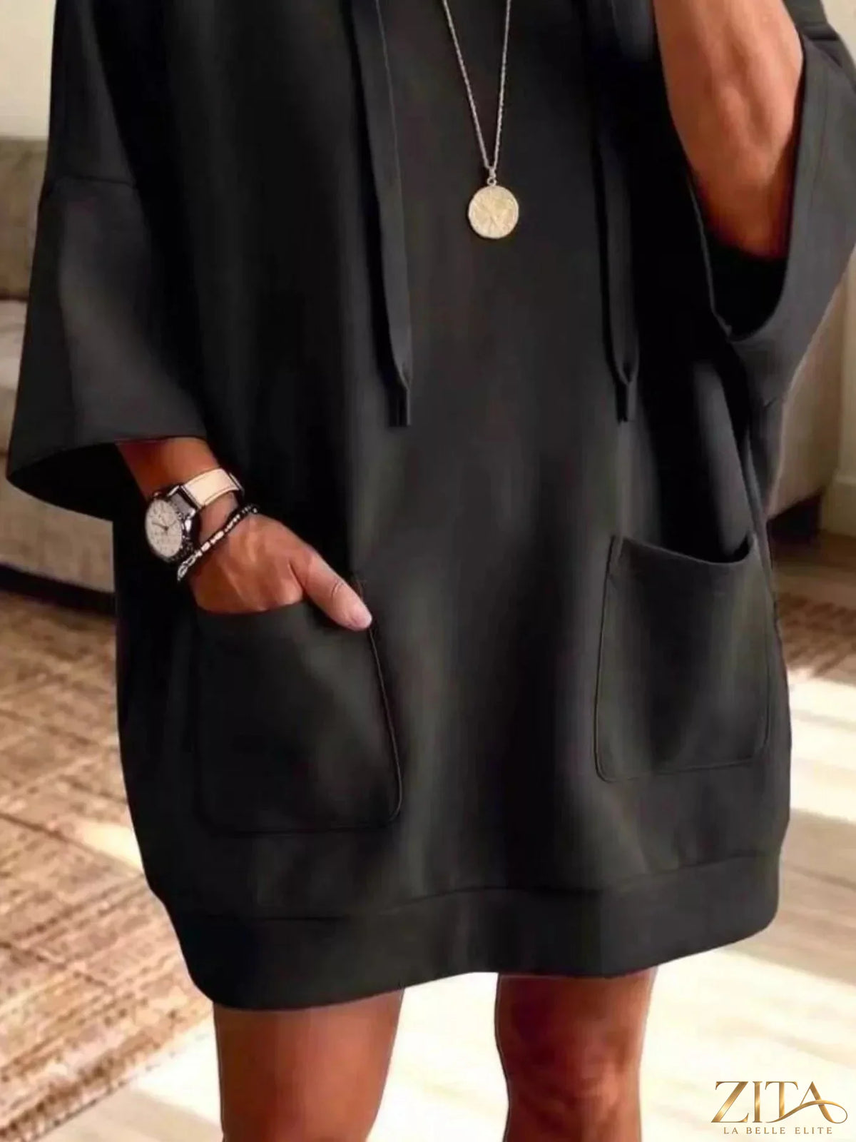 Plus size oversized drawstring hoodie with front pockets by Zita La Belle Elite, shown in a relaxed fit style.