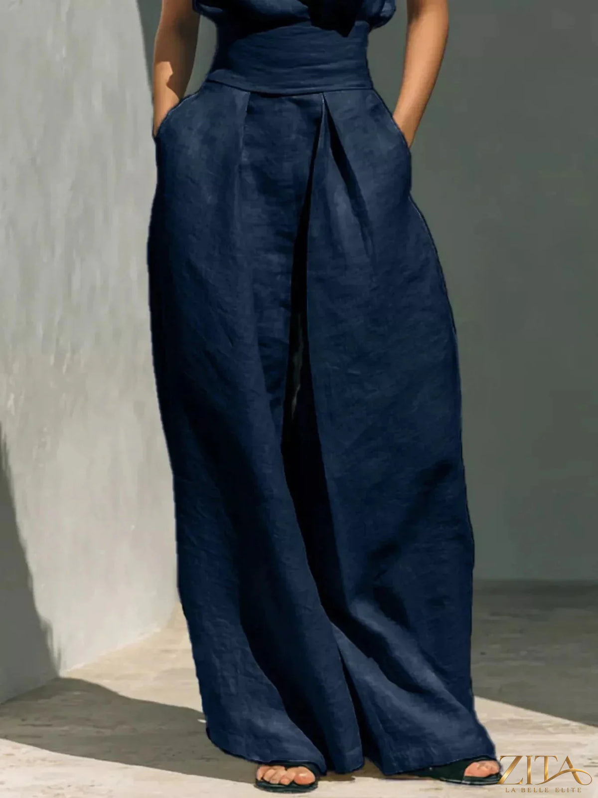 Plus size Zita La Belle Elite sleeveless turtleneck top and wide leg pants set, featuring a fitted turtleneck and flowing pants.