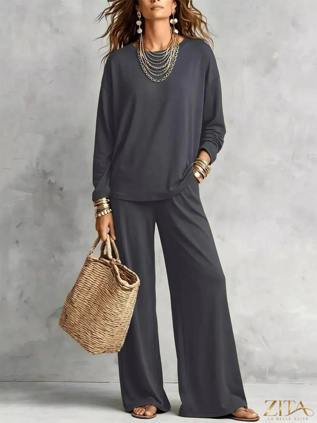 Zita La Belle Elite round neck T-shirt and wide-leg pants set in neutral fabric, displayed on a hanger against a plain background.