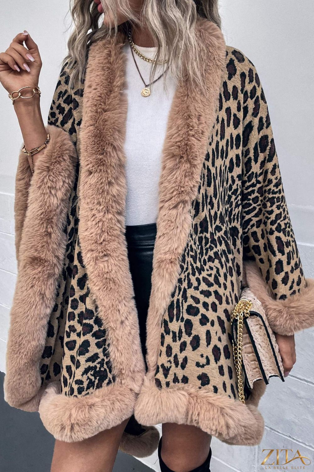 Leopard print open front poncho from Trendsi, featuring a flowing design and lightweight fabric, ideal for stylish layering.