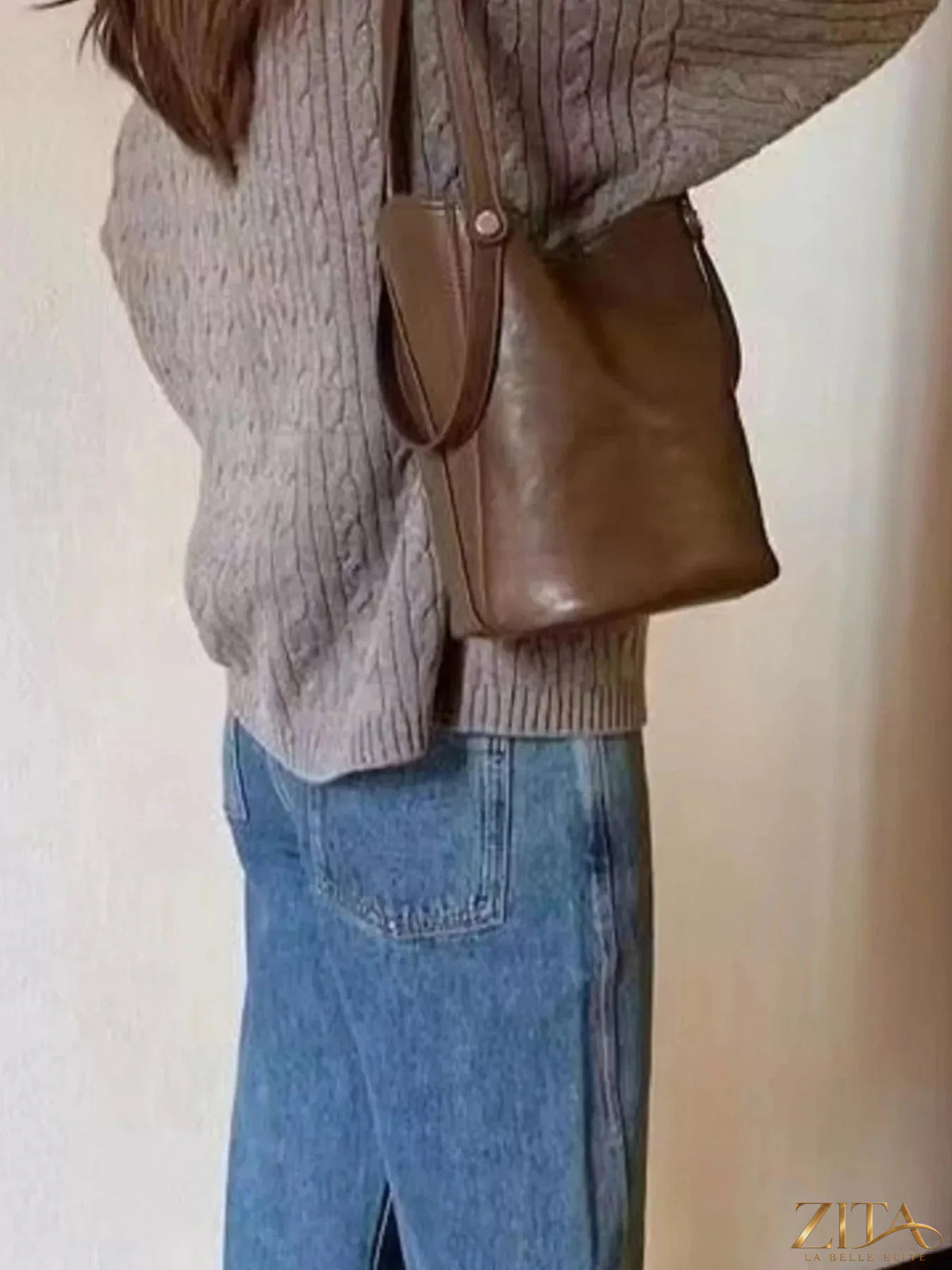 Leather bucket tote bag by Zita La Belle Elite with sturdy handles and spacious interior, showcasing a stylish and functional design.