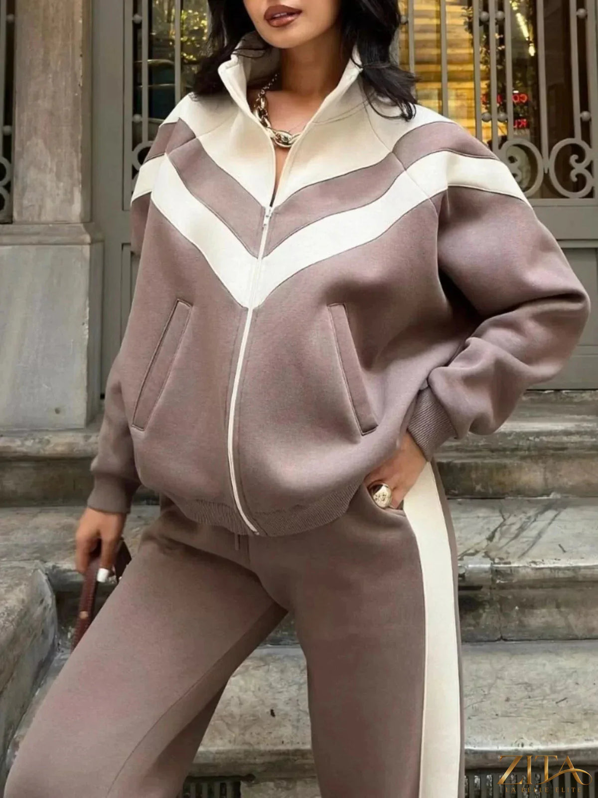 Color block zip-up outerwear and pants set by Zita La Belle Elite, featuring vibrant color blocking and casual, sporty style.