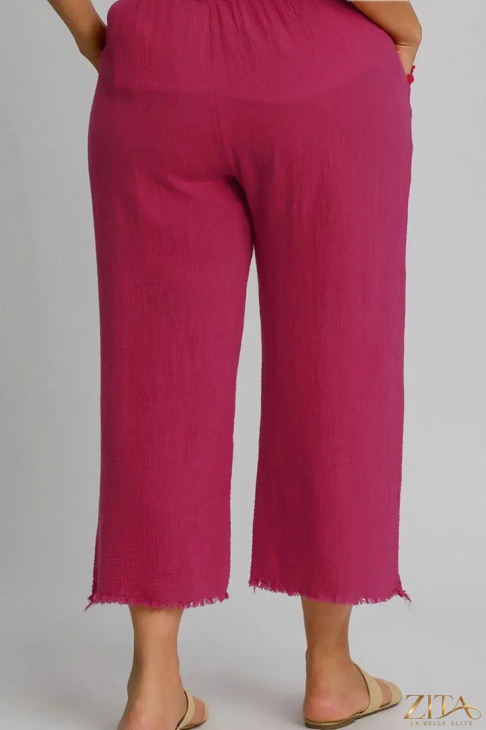 Plus size Umgee wide-leg pants by Zita La Belle Elite with raw hem, elastic waist, and comfortable fit, shown in a natural pose.