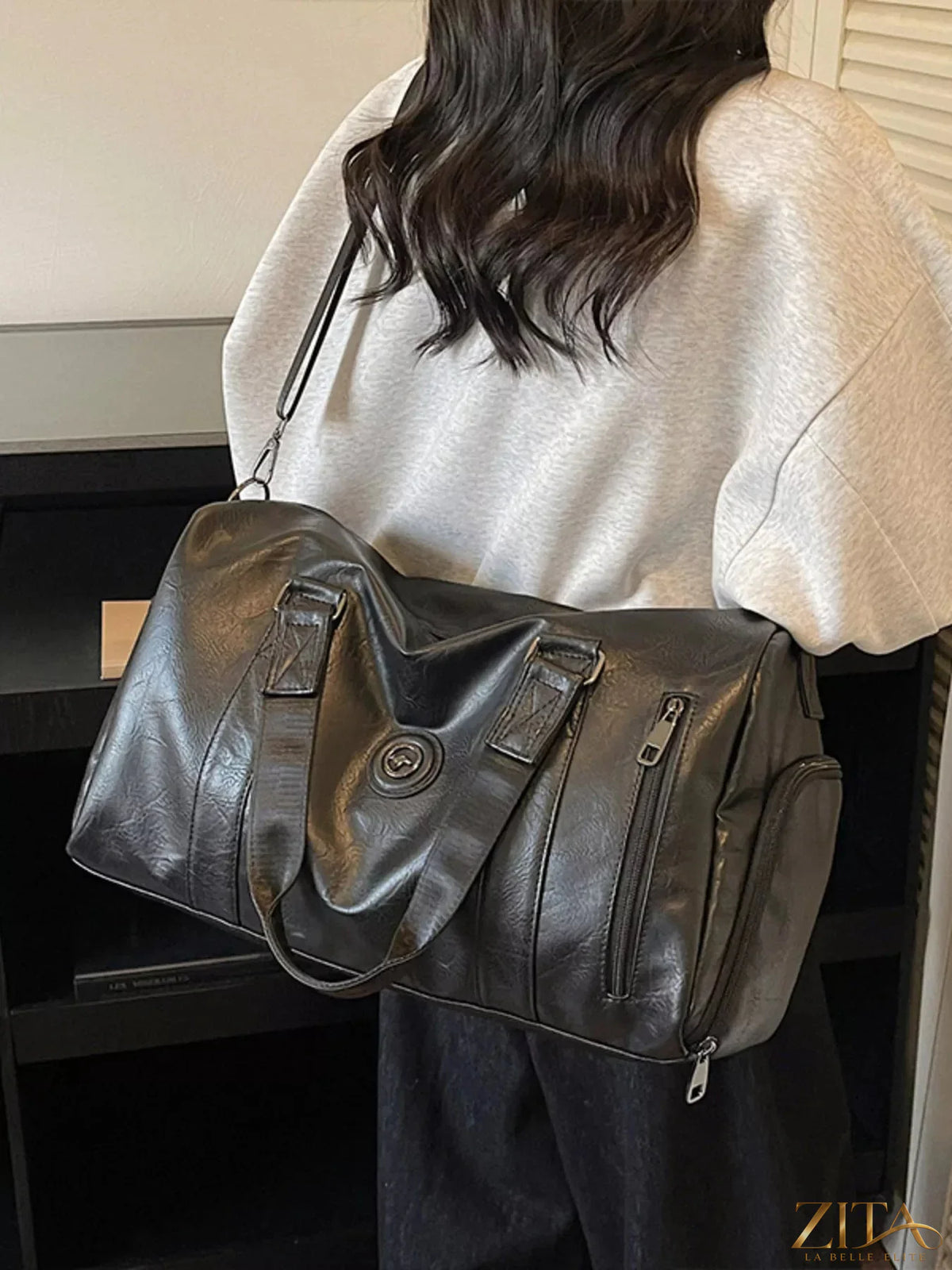 Trendsi PU leather duffel bag with sturdy handles and spacious main compartment, ideal for travel and gym use.