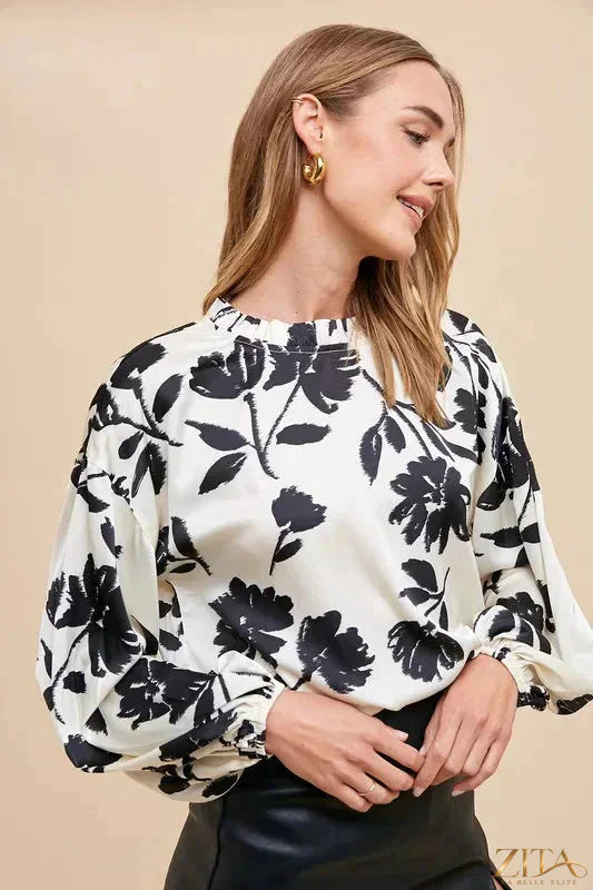 Zita La Belle Elite Annie Wear frill printed balloon sleeve blouse with floral design and ruffled cuffs on a white background.