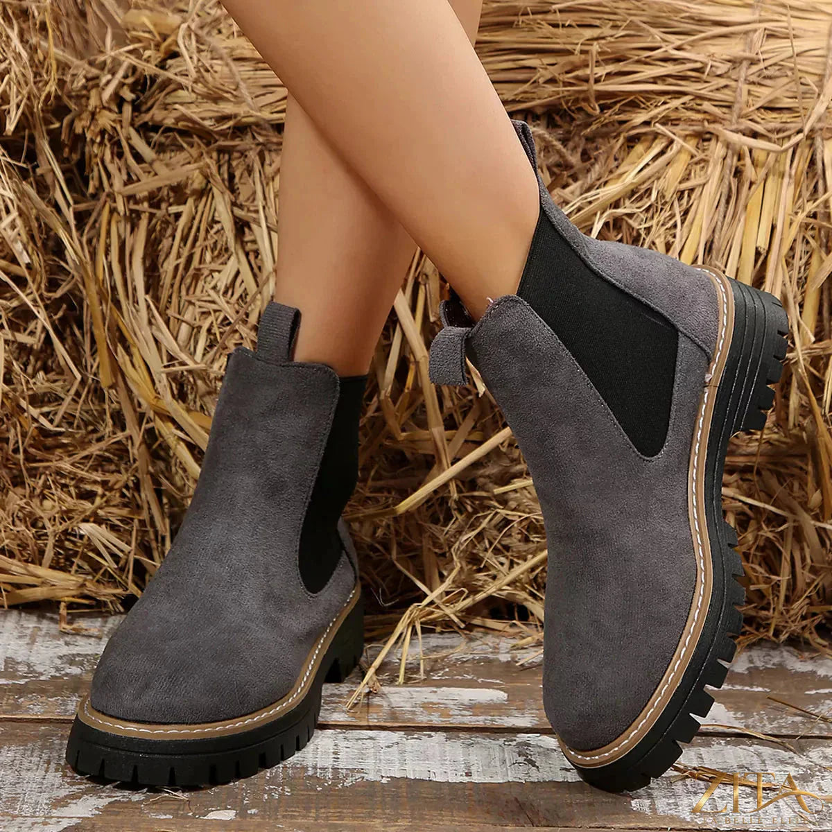 Zita La Belle Elite round toe platform boots with chunky heels and sleek black leather finish standing on a white background