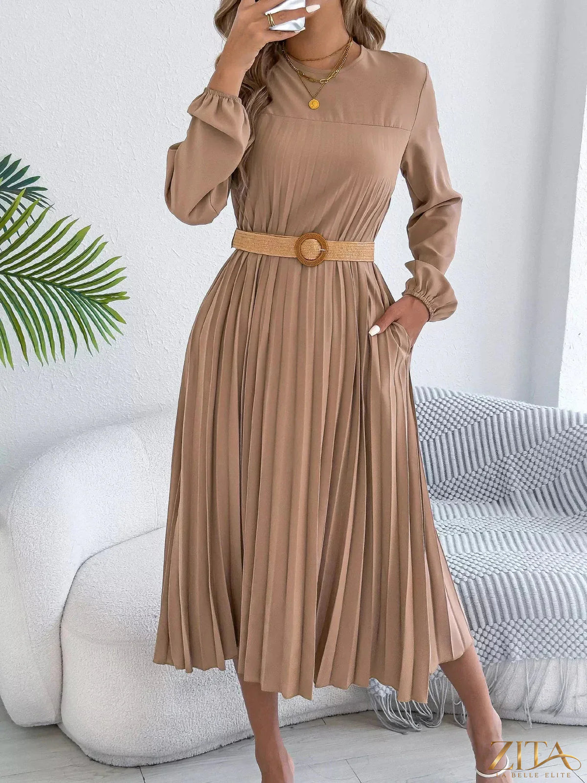 Zita La Belle Elite pleated A-line midi dress with a flowy silhouette and elegant design, shown in a stylish image.