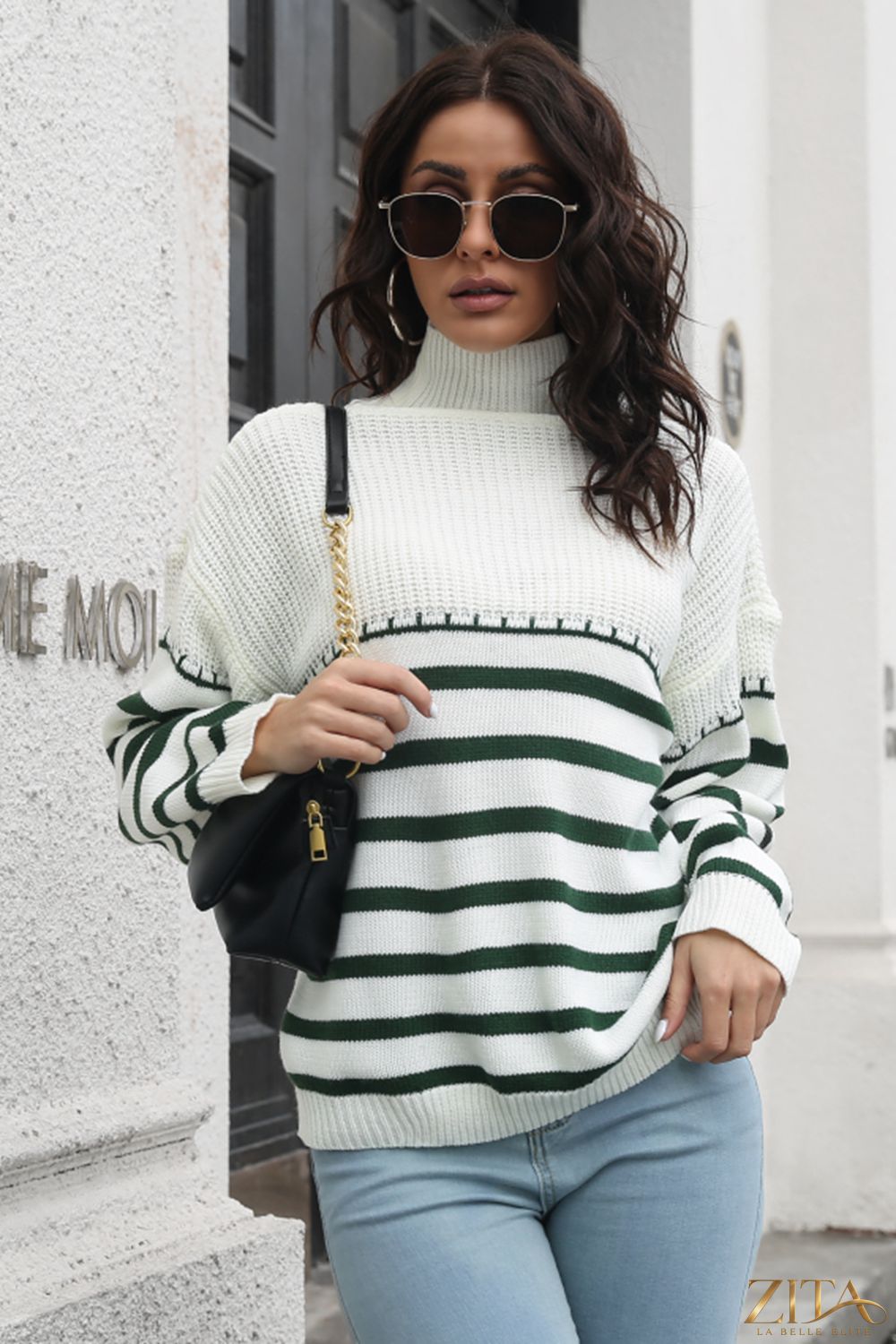 Striped turtleneck drop shoulder sweater by Trendsi featuring a cozy knit design and bold color stripes.