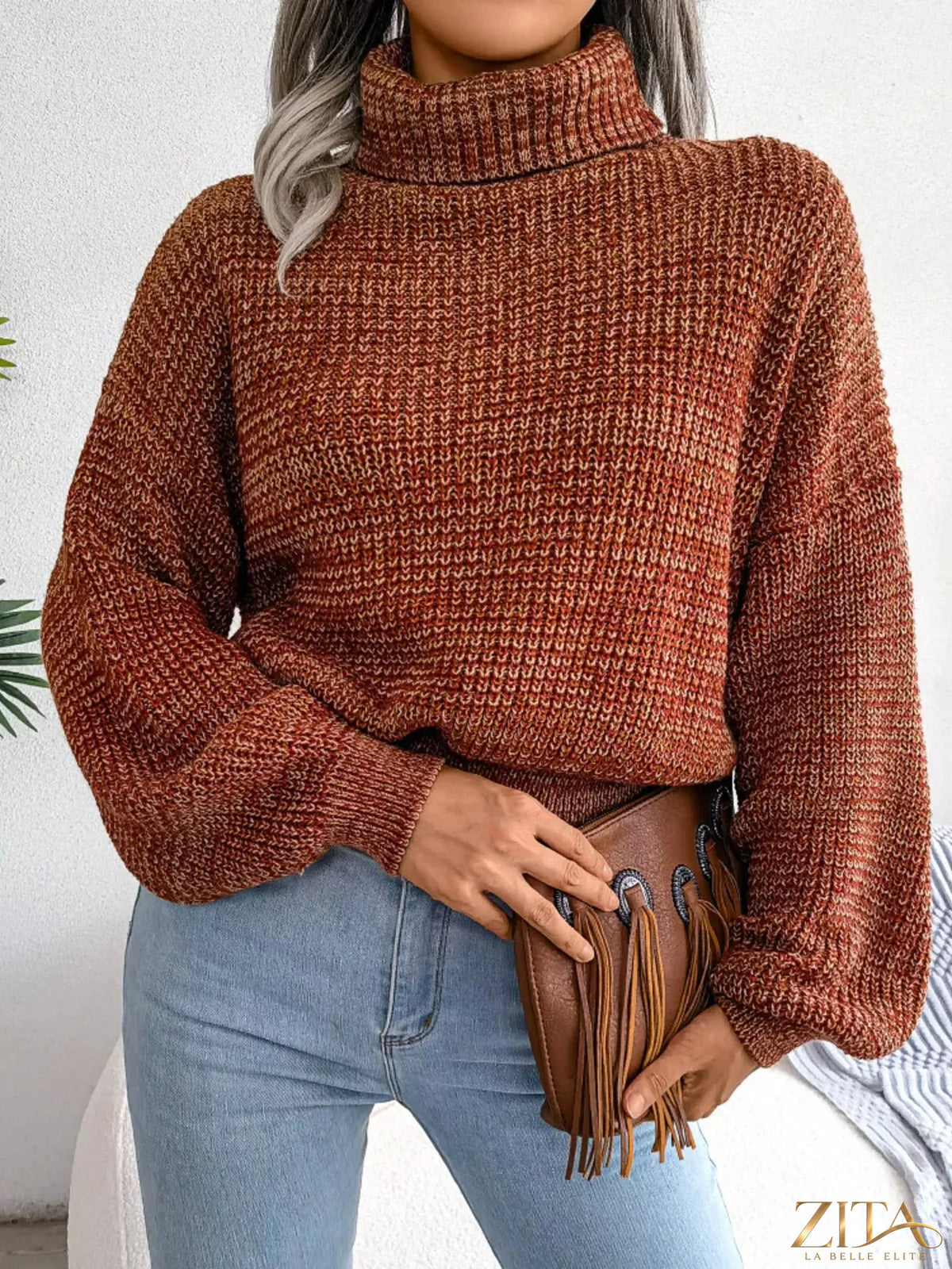 Cream turtleneck dropped shoulder sweater by Trendsi, featuring a cozy fit and ribbed cuffs, styled on a model.