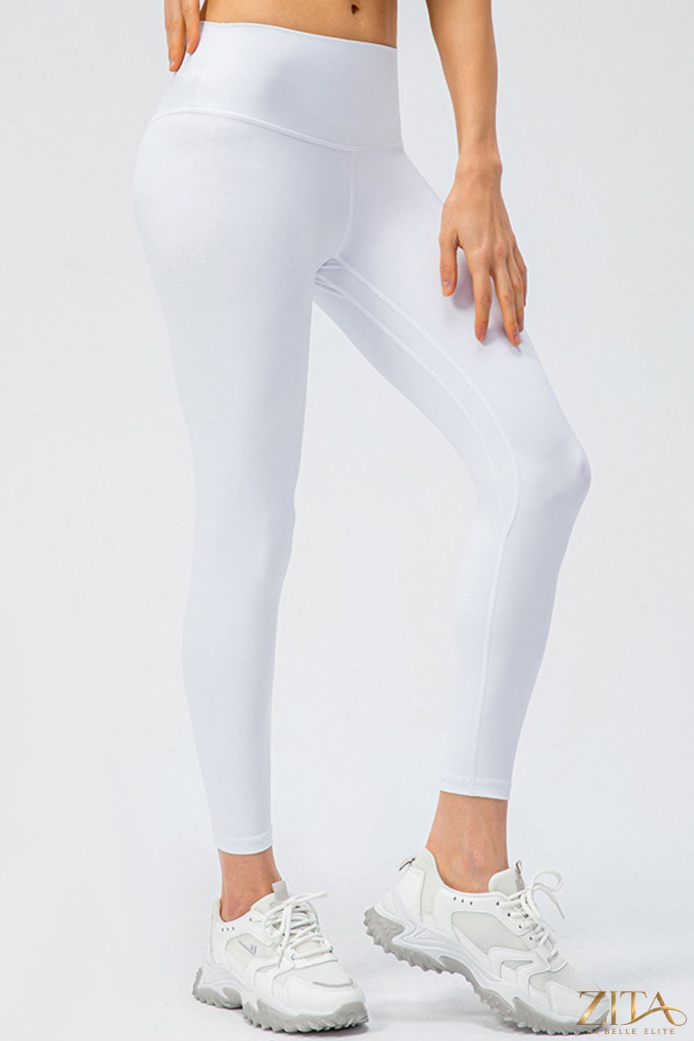 Black slim fit active leggings with wide waistband from Trendsi, shown flat on a white background.
