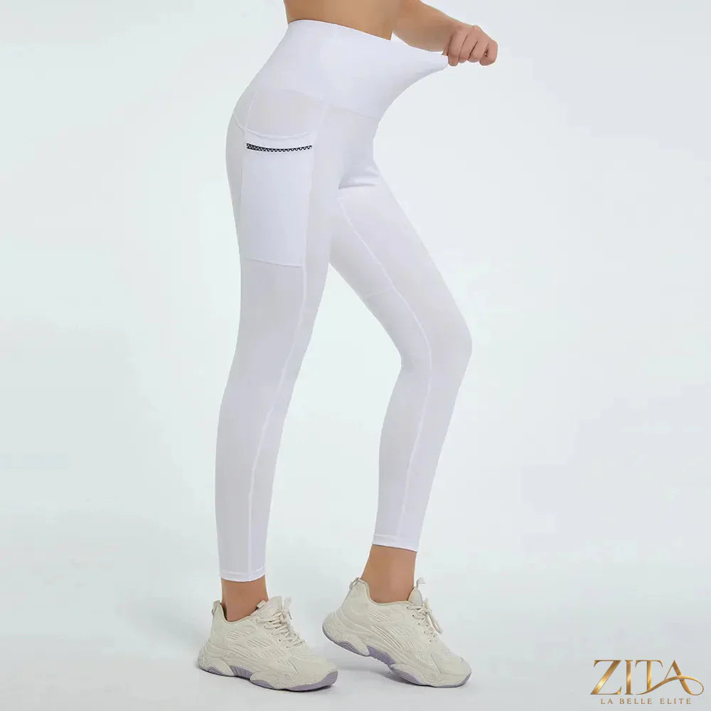 High waist active leggings by Trendsi, showing a close-up of the black stretchy fabric and waistband for workout comfort.