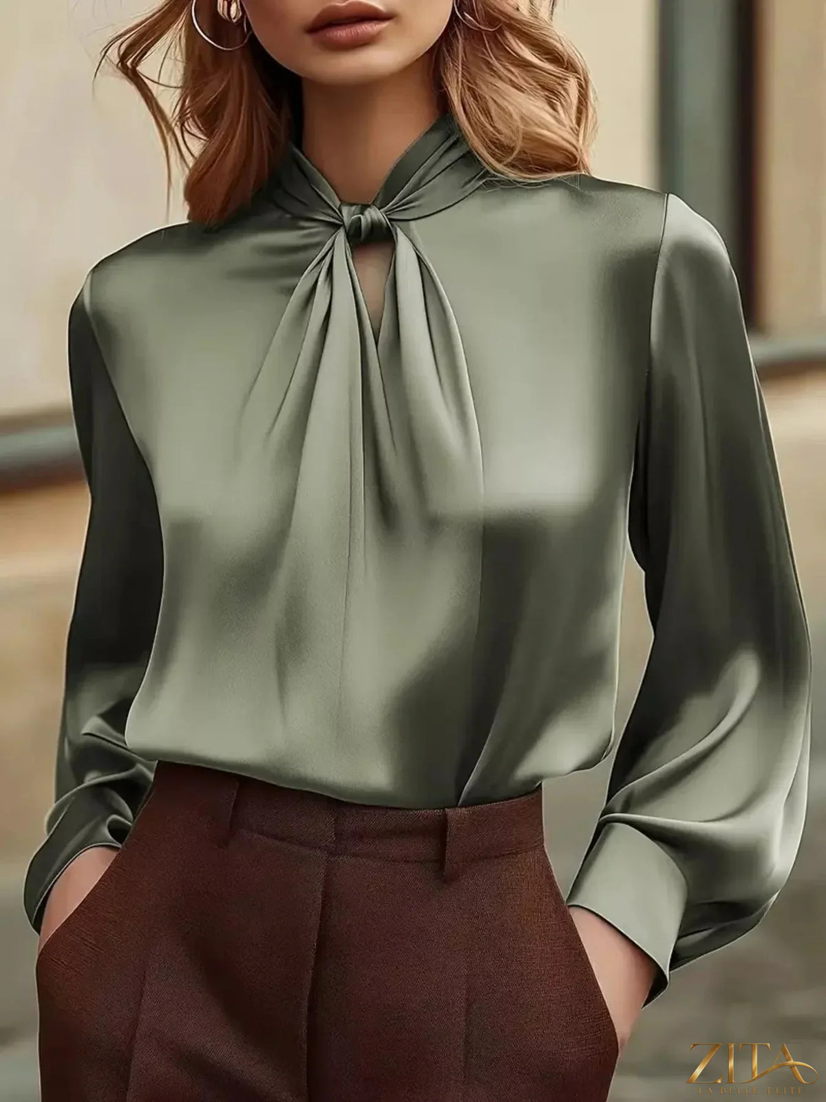 Zita La Belle Elite satin cutout front blouse featuring a stylish neckline and elegant design, shown in a close-up image.