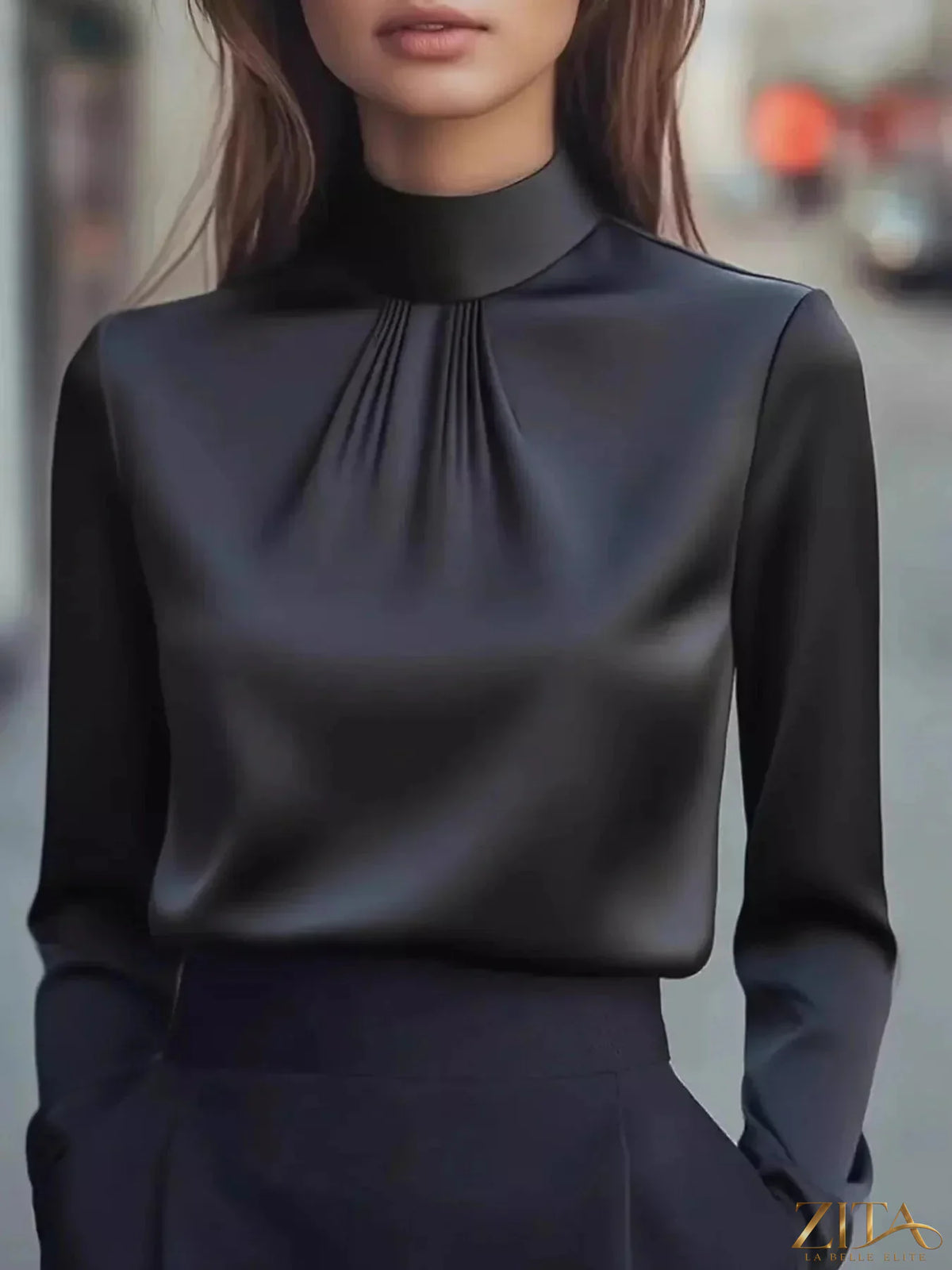 Zita La Belle Elite mock neck long sleeve blouse with pleated detail, featuring a fitted design and elegant fabric.