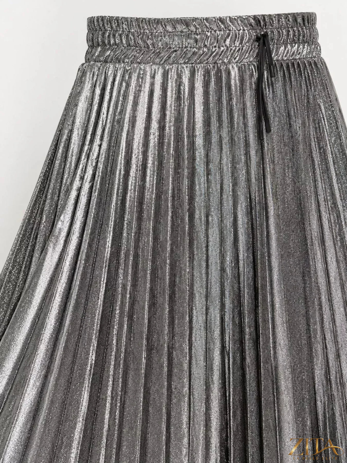 High-waisted pleated maxi skirt from Trendsi with flowing fabric and elegant design, shown in a natural pose.