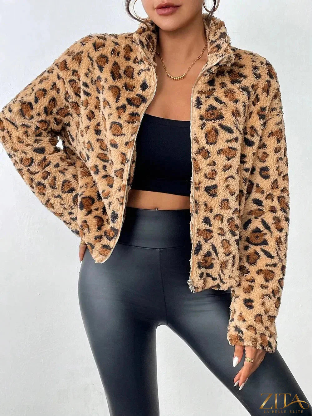 Fuzzy leopard print turtleneck zip-up jacket by Trendsi, featuring a soft texture and stylish design, shown on a model.