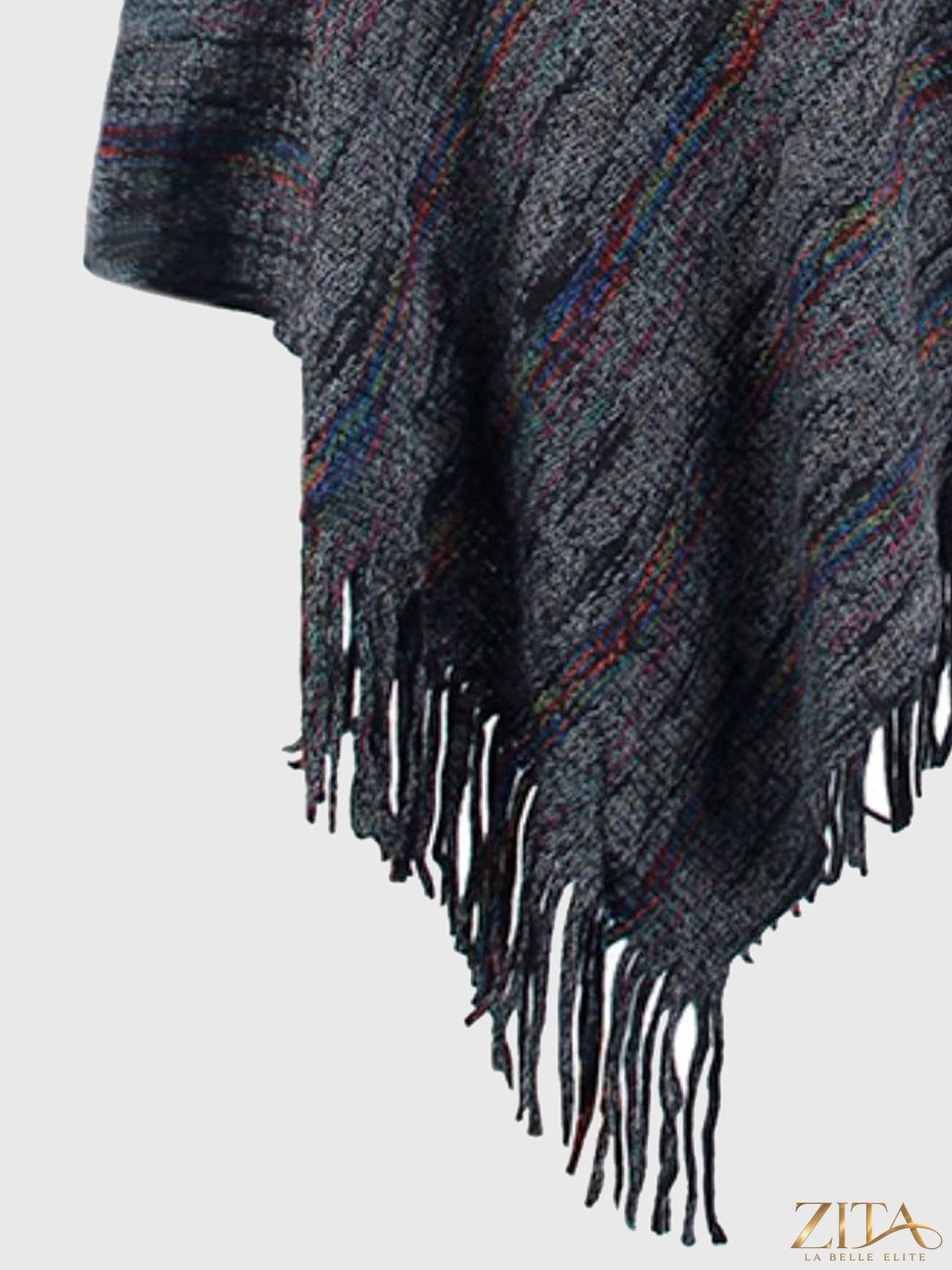 Zita La Belle Elite fringe hem hooded poncho in cozy fabric, featuring a draped design with fringe details at the hem.