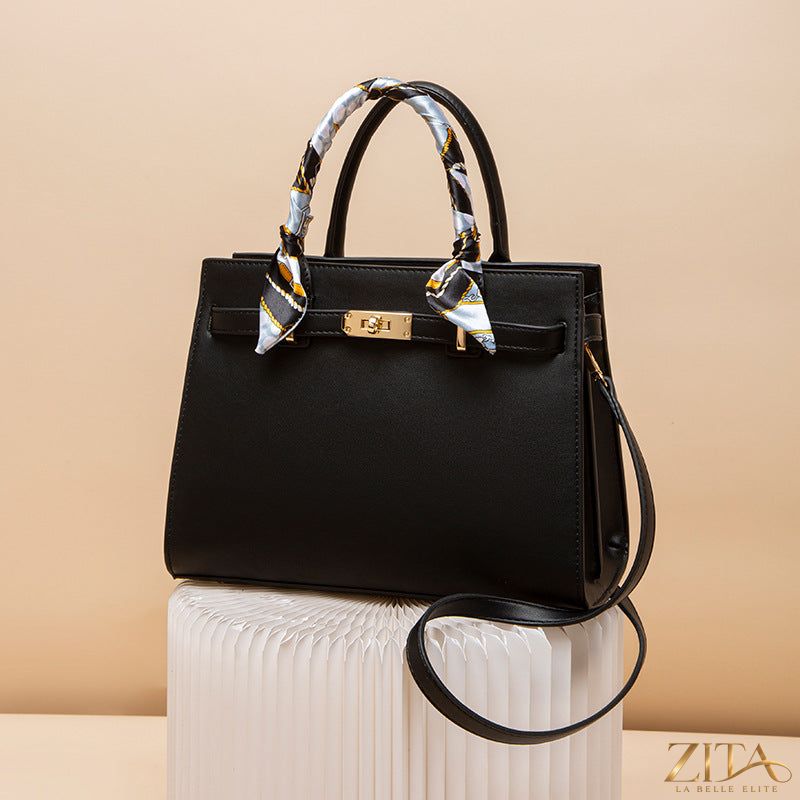 Zita La Belle Elite top handle leather handbag with structured design and gold-tone hardware, showcasing its elegant look.