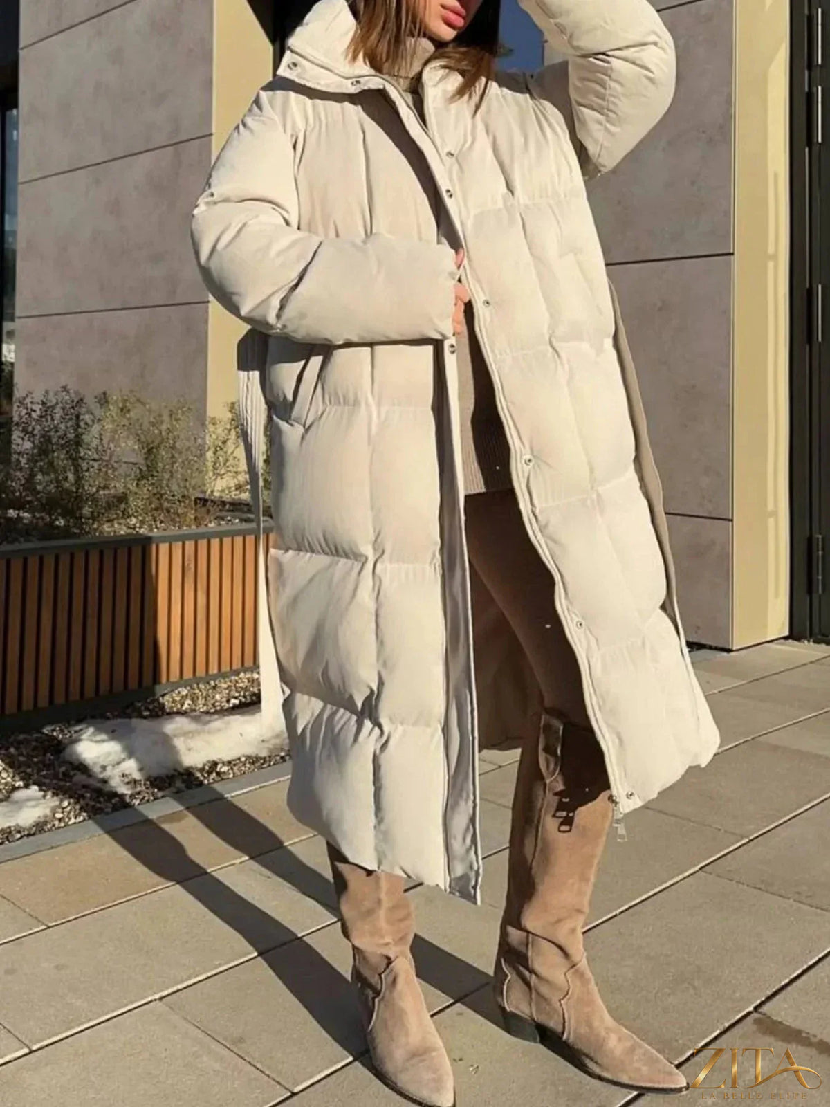 Longline padded winter coat with belt from Zita La Belle Elite, featuring a plush filled design and stylish belted waist.