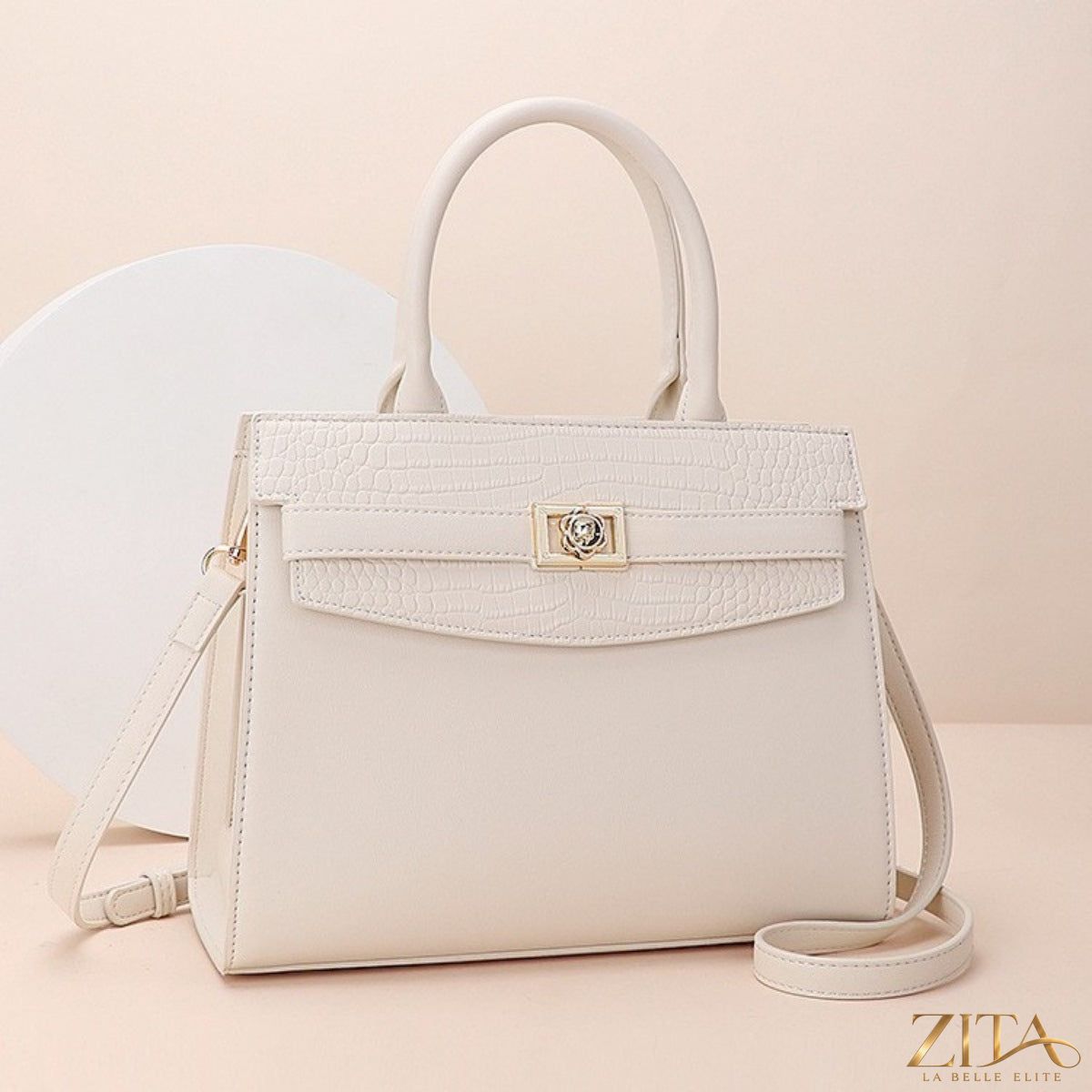 Zita La Belle Elite top handle leather handbag with structured design and gold-tone hardware, showcasing its elegant style.