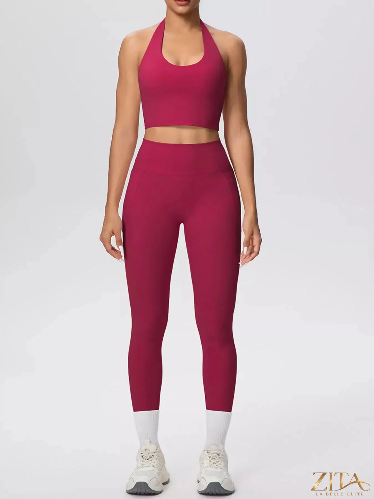 Zita La Belle Elite halter neck crop top and high-waisted leggings active set, black athletic wear on a model.