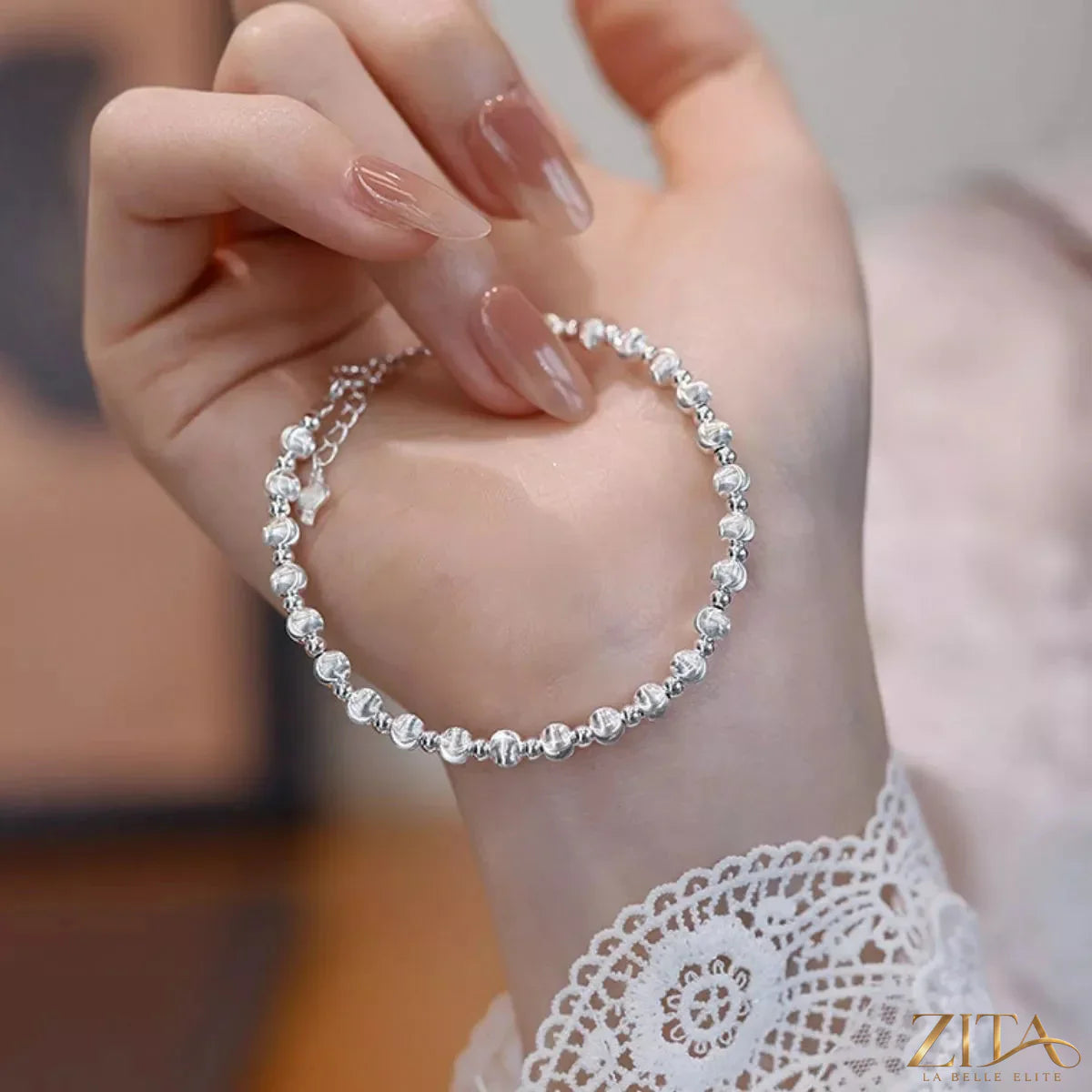 Sterling silver beaded bracelet with round beads, stylish jewelry accessory from Trendsi, close-up of bracelet on a neutral background.