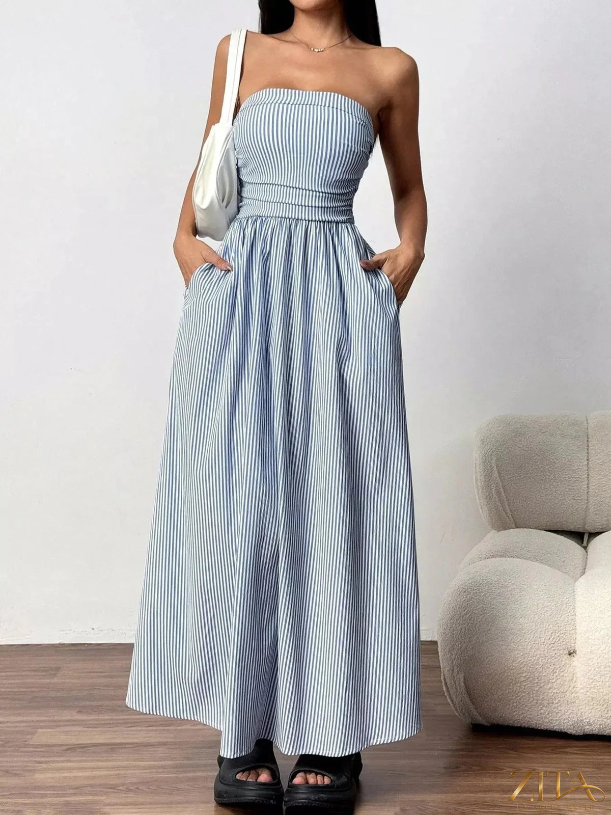 Striped strapless casual maxi dress by Zita La Belle Elite, featuring a flowing silhouette and vibrant pattern.