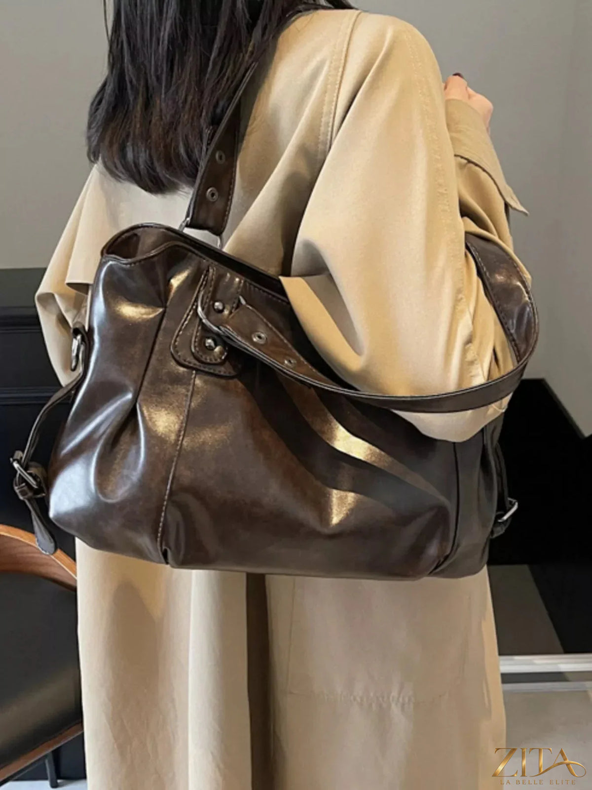 Vintage style leather handbag by Trendsi, featuring a classic design with sturdy handles and detailed stitching.