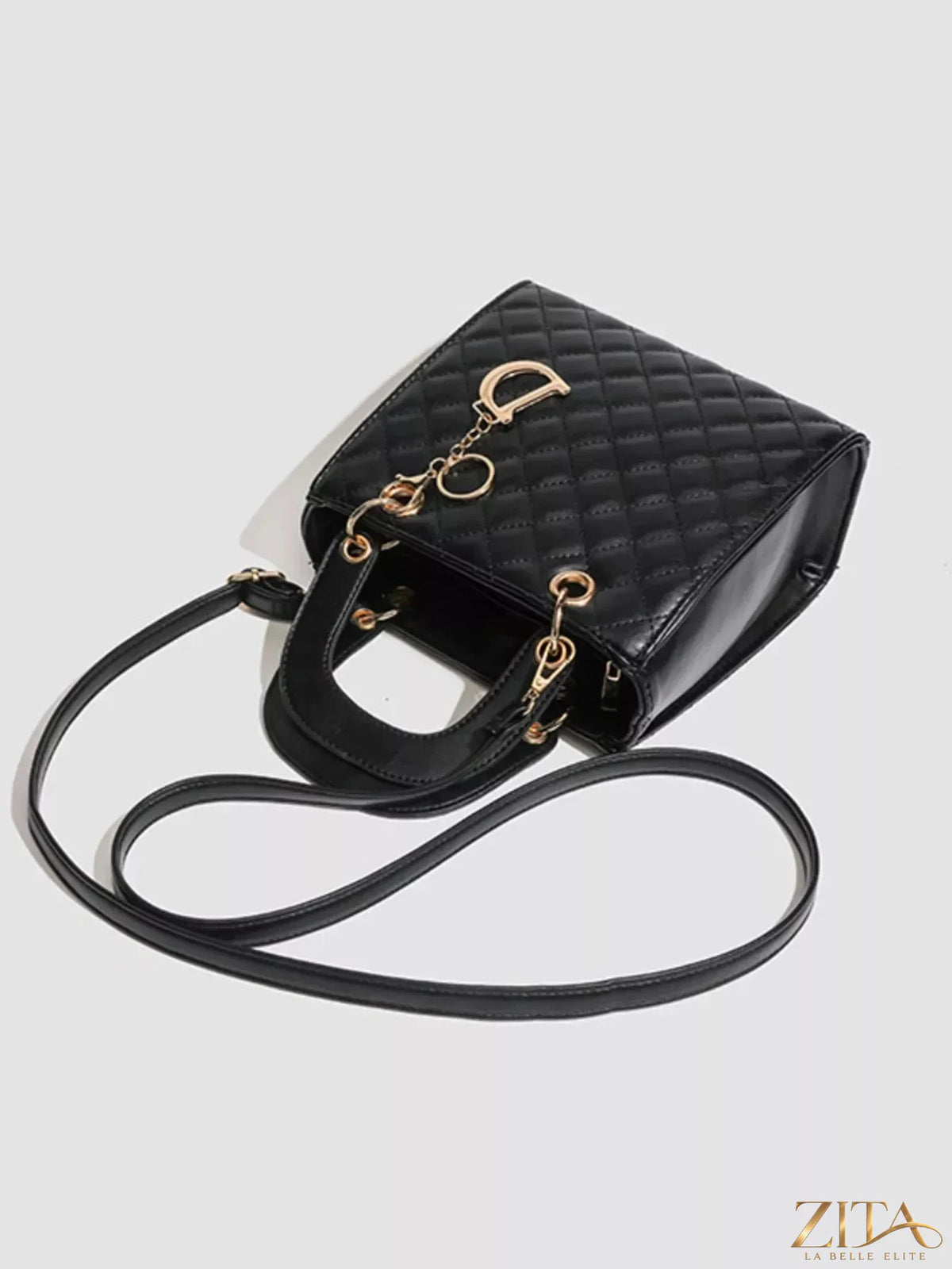 Zita La Belle Elite quilted top handle handbag with gold hardware and a structured design on smooth leather.