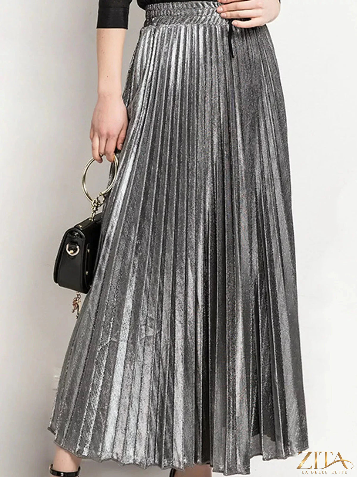 High-waisted pleated maxi skirt from Trendsi, flowing fabric with a flattering high waist and elegant pleats.