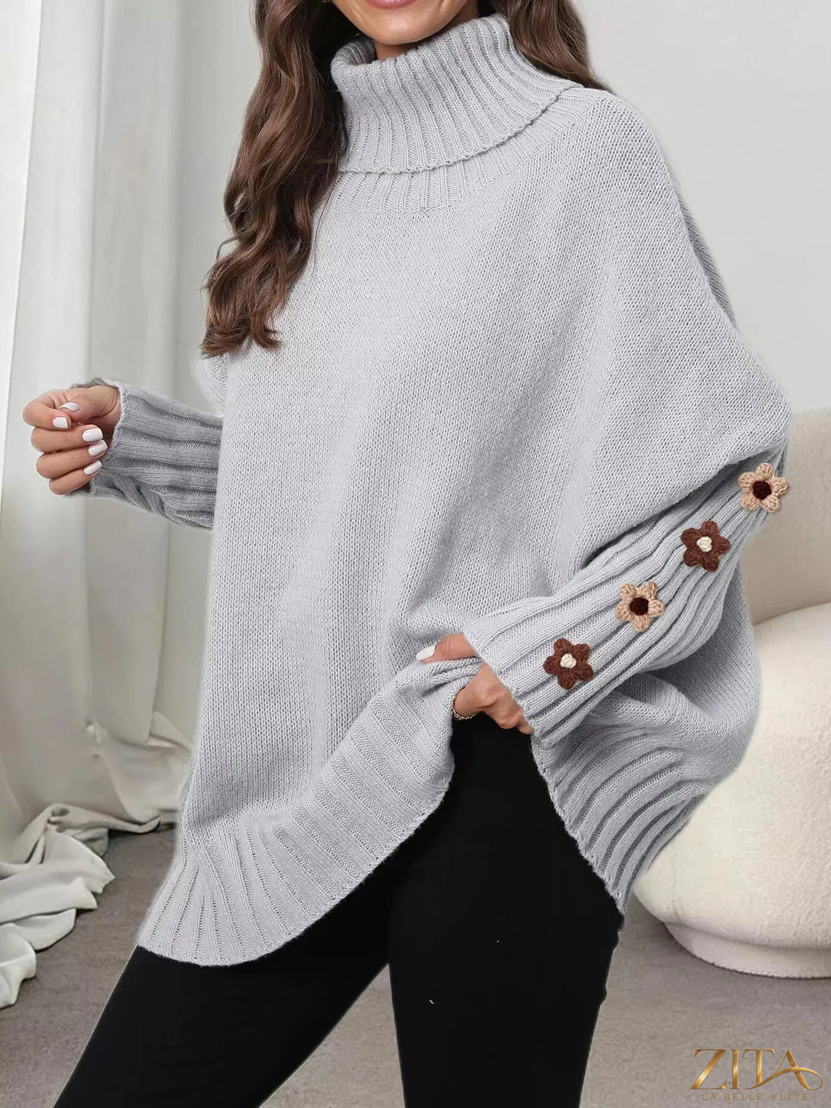 Zita La Belle Elite oversized turtleneck sweater with floral applique sleeves, soft knit fabric and relaxed fit.