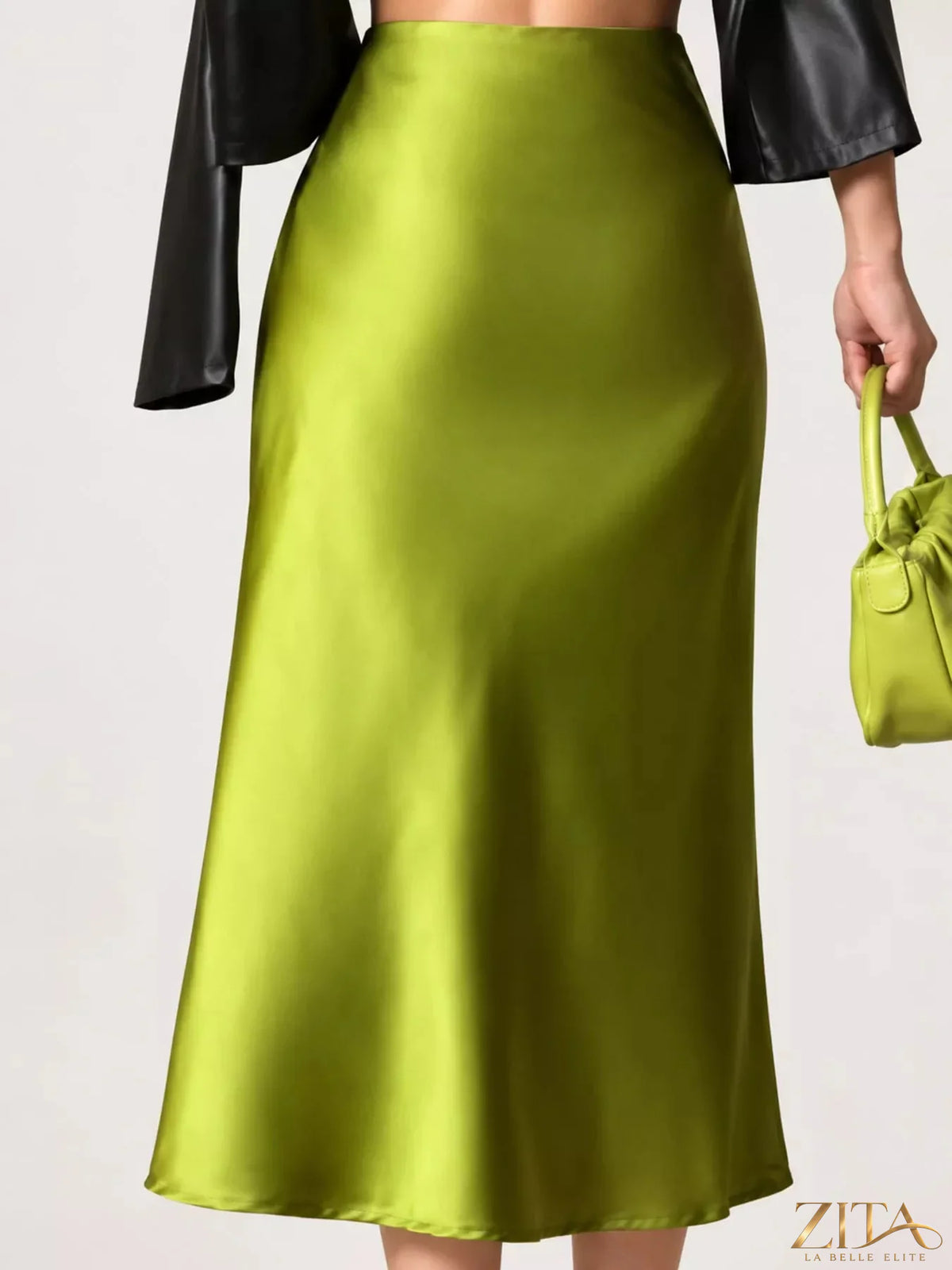 High-waisted satin midi skirt from Trendsi shown on a mannequin, featuring a sleek, shiny fabric and elegant midi length.
