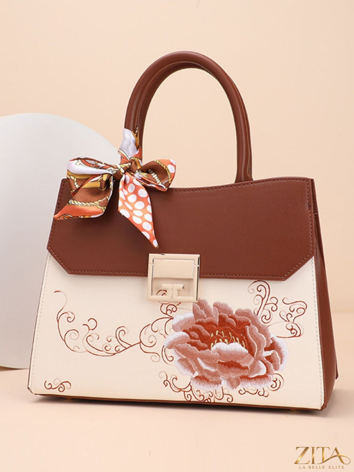 Zita La Belle Elite floral top handle handbag with colorful flower design and elegant leather strap.