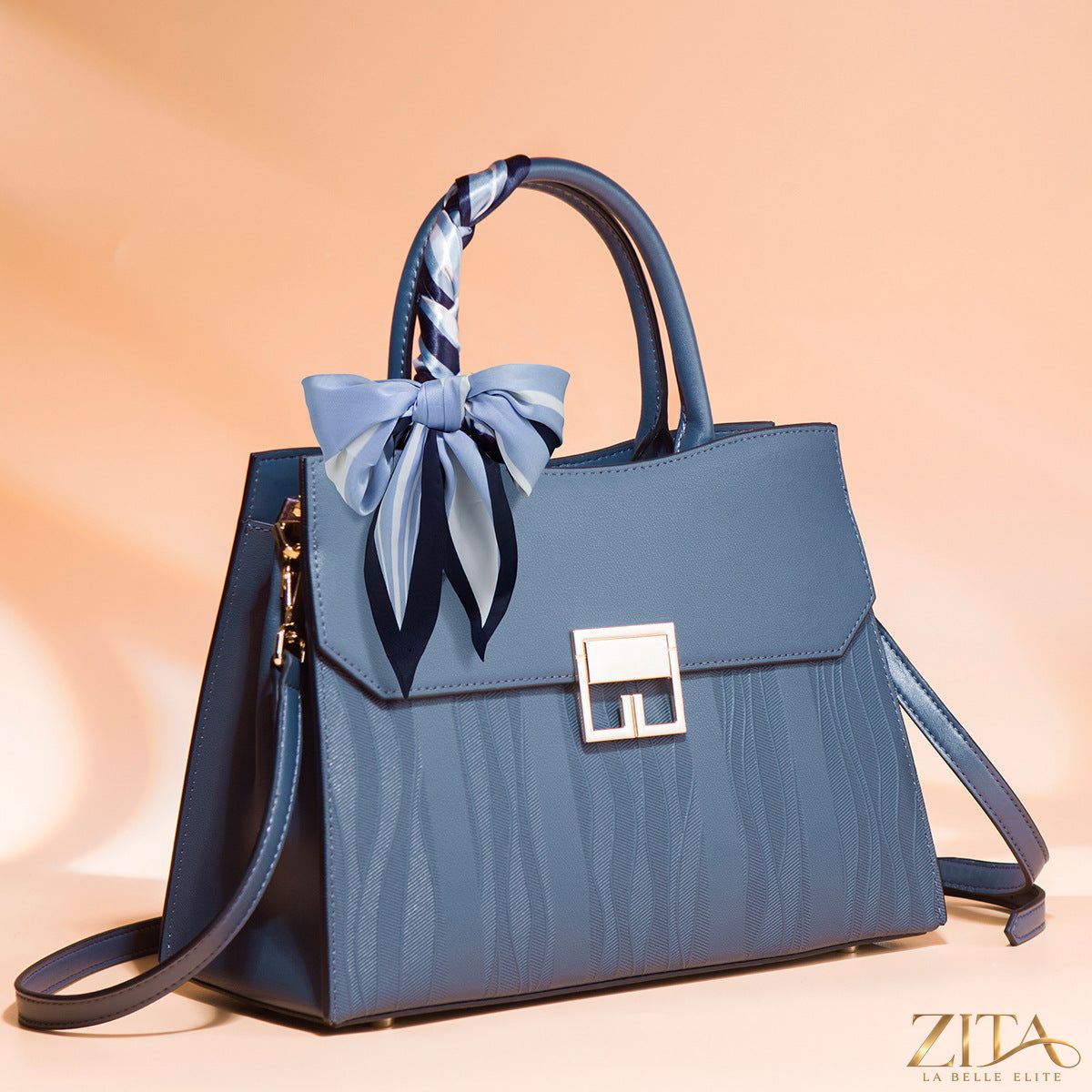 Zita La Belle Elite leather handbag with scarf decor, featuring a stylish design and textured leather surface.