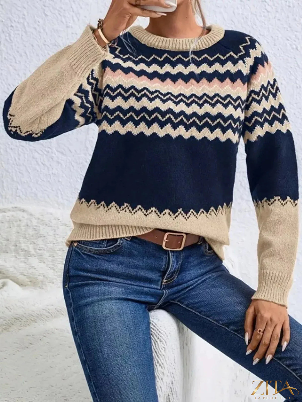 Geometric pattern knitted sweater in neutral tones, featuring a cozy fit and stylish design from Trendsi.