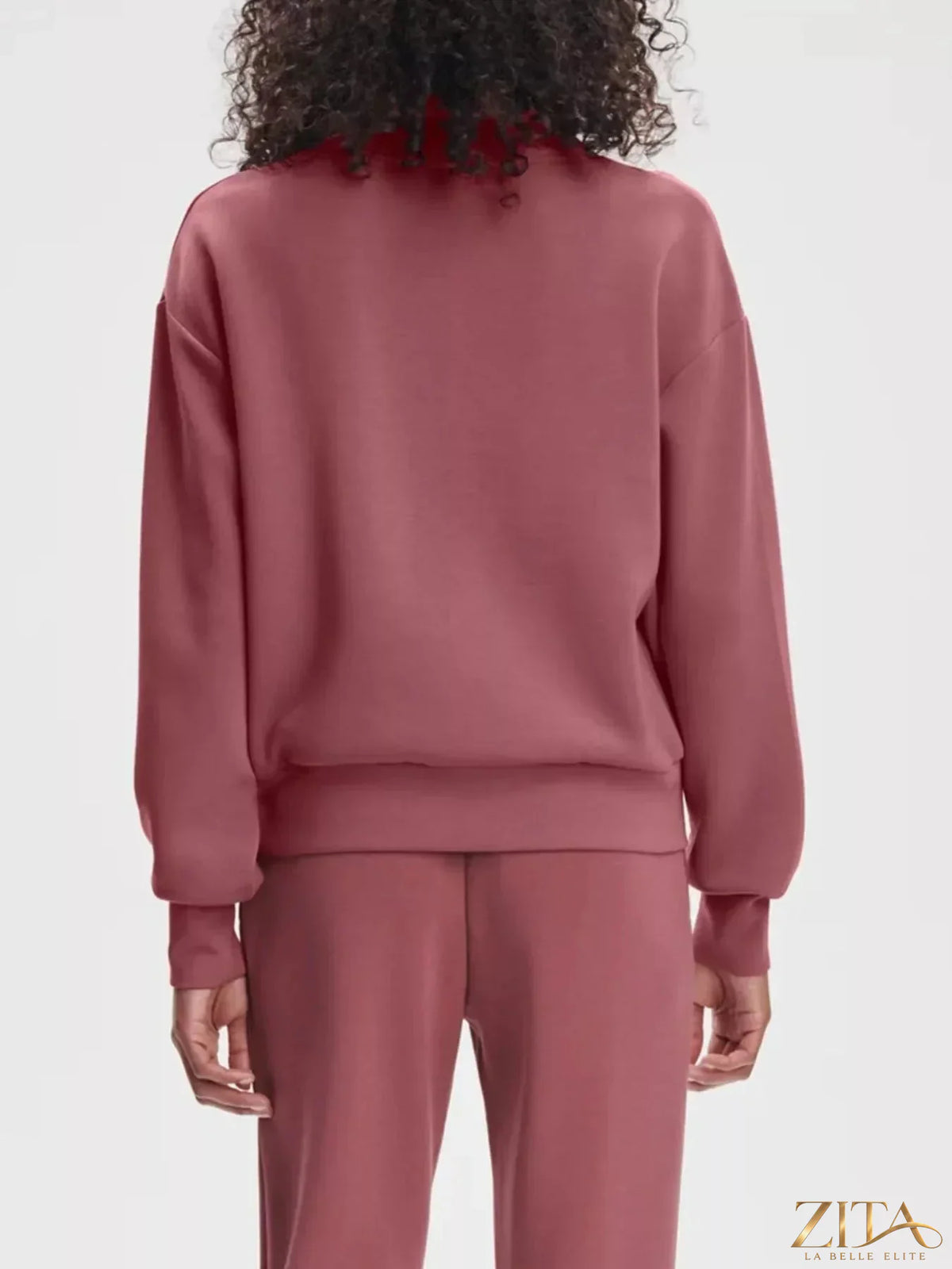 Zita La Belle Elite quarter-zip sweatshirt and wide-leg pants set in soft fabric, shown in a casual indoor setting.