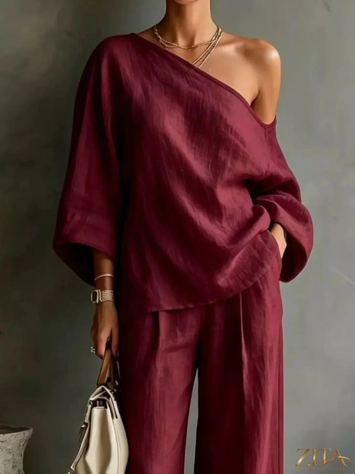 Zita La Belle Elite one-shoulder top and wide-leg pants set, stylish fashion ensemble, featuring a modern one-shoulder design and flowing pants.