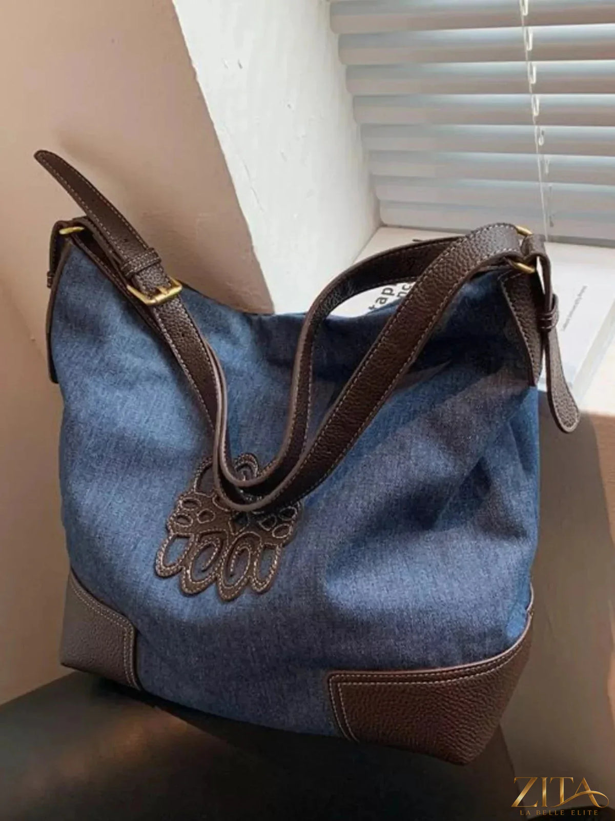 Embroidered canvas tote bag by Zita La Belle Elite with colorful floral designs and sturdy handles for everyday use.