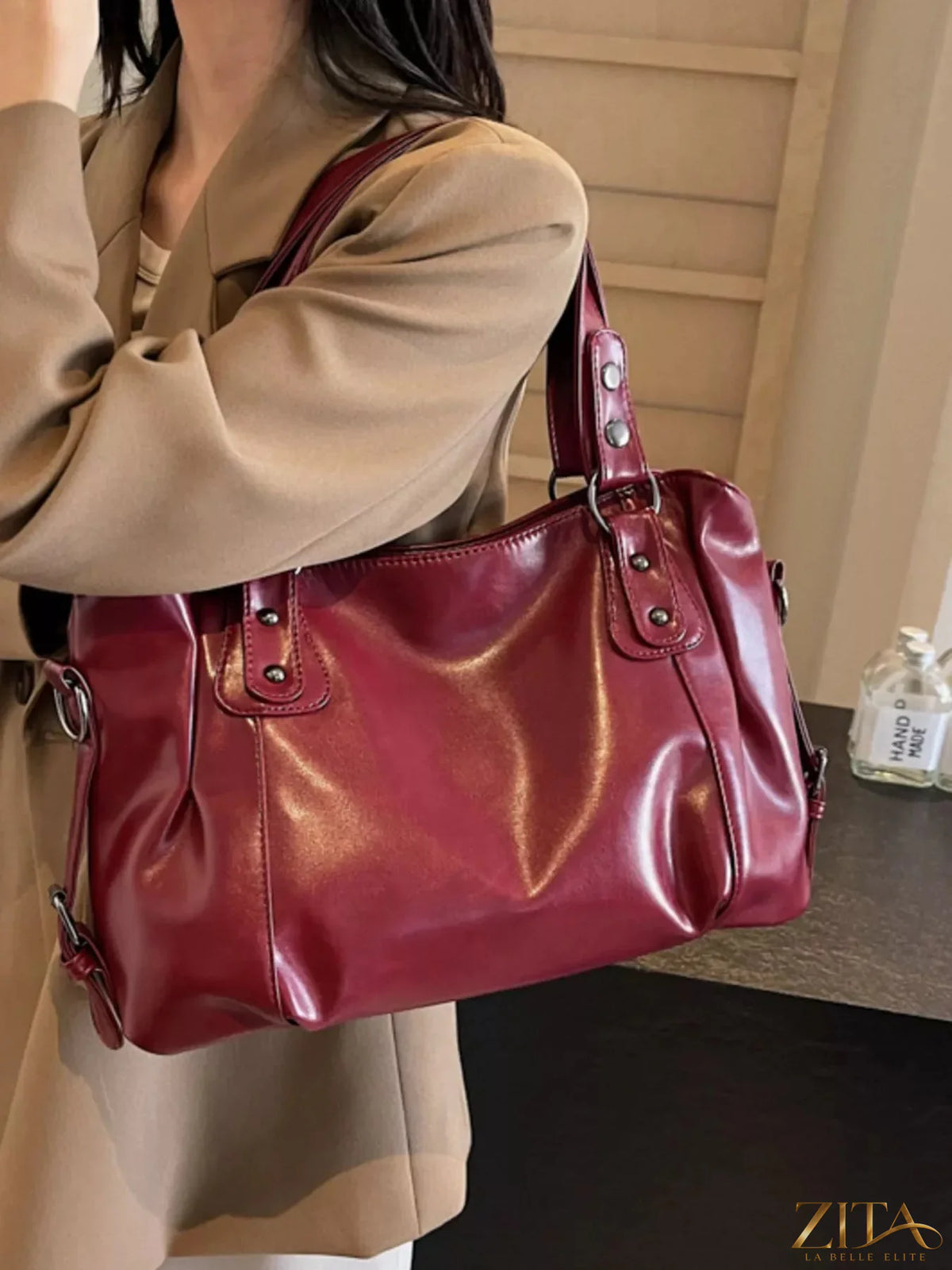Vintage style leather handbag from Trendsi featuring a classic design with sturdy leather straps and a spacious interior.
