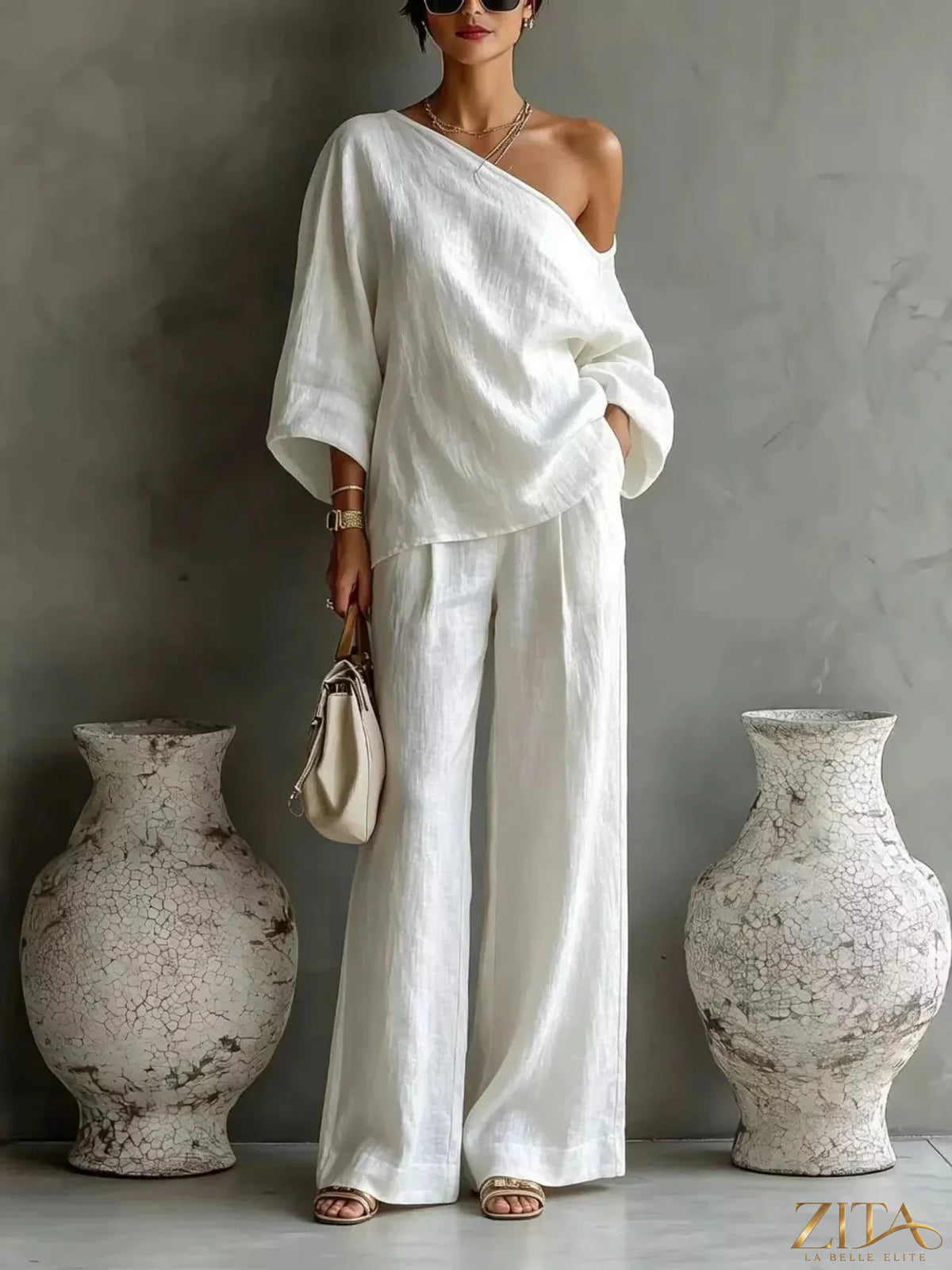 Zita La Belle Elite one-shoulder top and wide-leg pants set in neutral fabric, displayed on a mannequin.