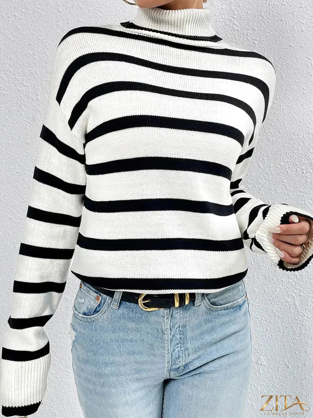 Striped turtleneck long sleeve sweater by Trendsi, featuring a cozy fit with multicolor horizontal stripes and ribbed cuffs.
