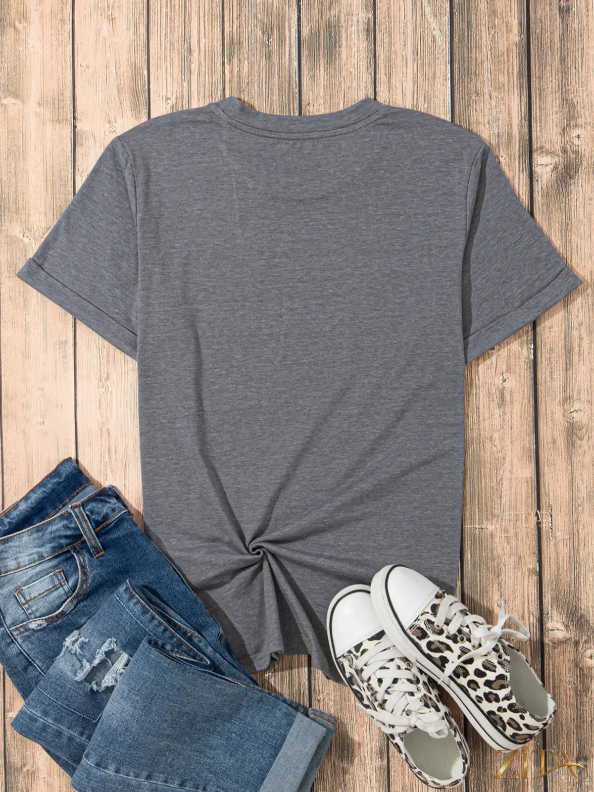 Sequin bow short sleeve T-shirt by Trendsi featuring a shiny bow detail on a casual tee with short sleeves.