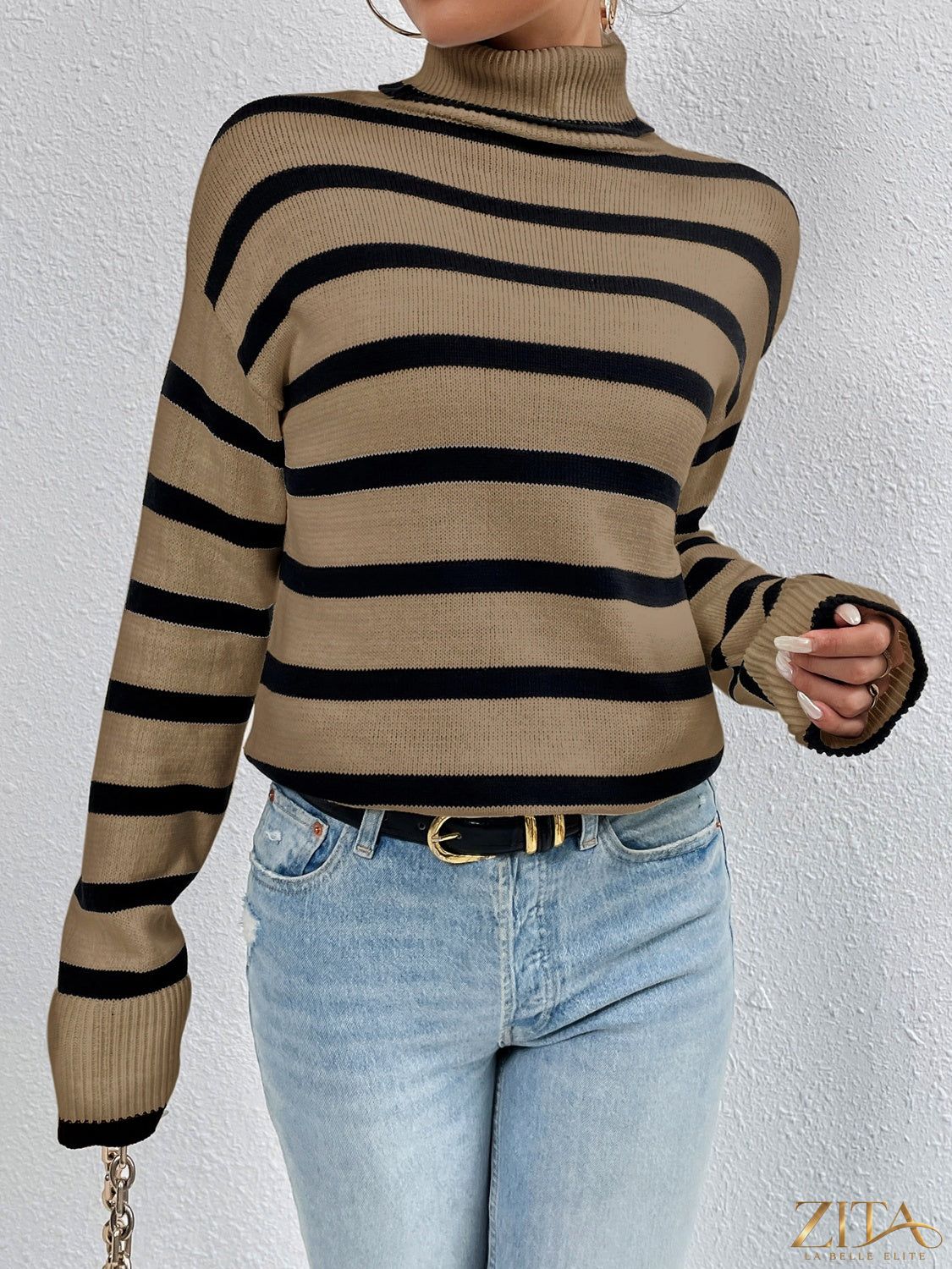 Striped turtleneck drop shoulder sweater from Trendsi featuring bold horizontal stripes and cozy knit fabric.