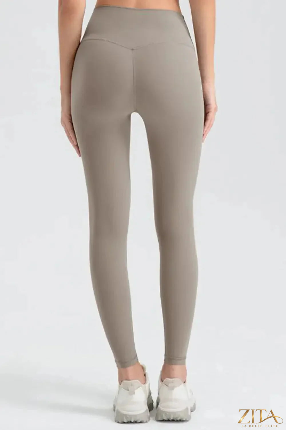 Black wide waistband sport leggings by Trendsi, featuring stretchy fabric and comfortable fit for activewear or casual wear.