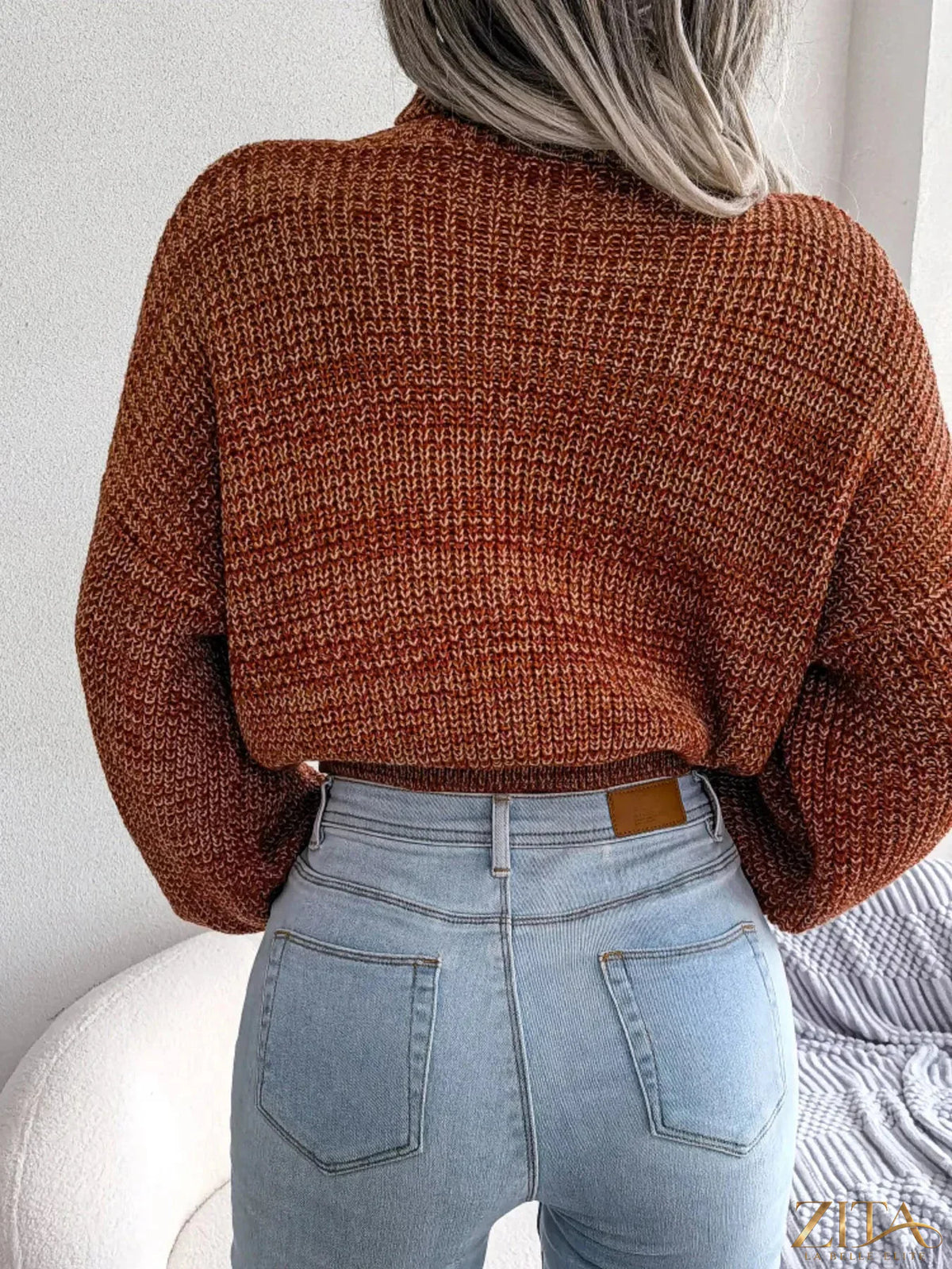 Cream-colored turtleneck dropped shoulder sweater by Trendsi, featuring a cozy knit fabric and relaxed fit, displayed on a mannequin.