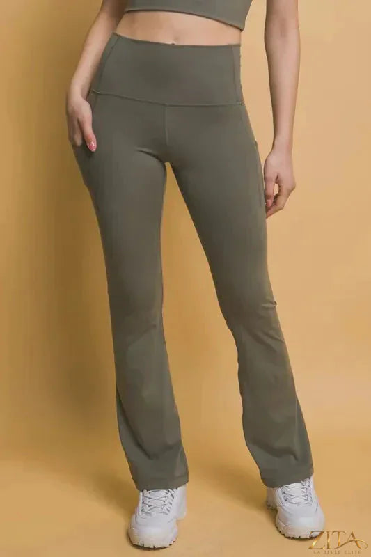 High waist flare active leggings with side pockets by Trendsi, featuring a stylish fit and comfortable stretch fabric.