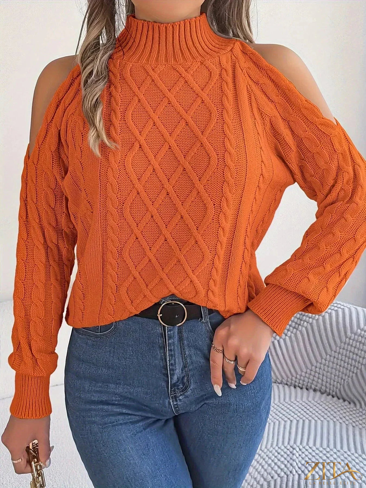 Zita La Belle Elite cold-shoulder cable knit sweater showing the stylish design with open shoulders and textured knit pattern.