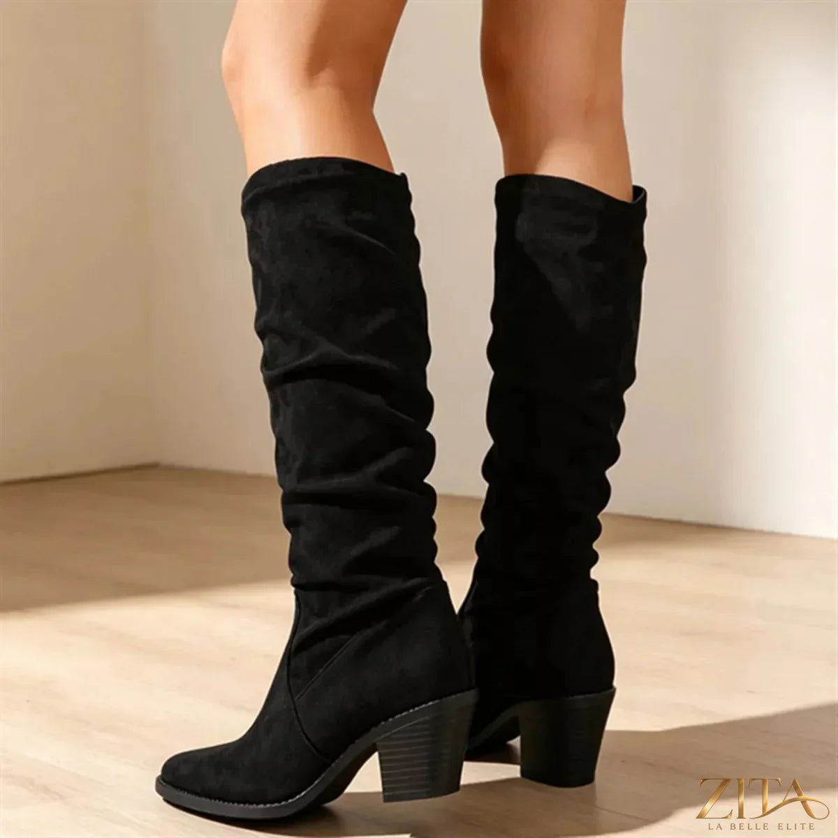 Zita La Belle Elite point toe block heel boots featuring sleek design and stylish silhouette, shown in a neutral color.