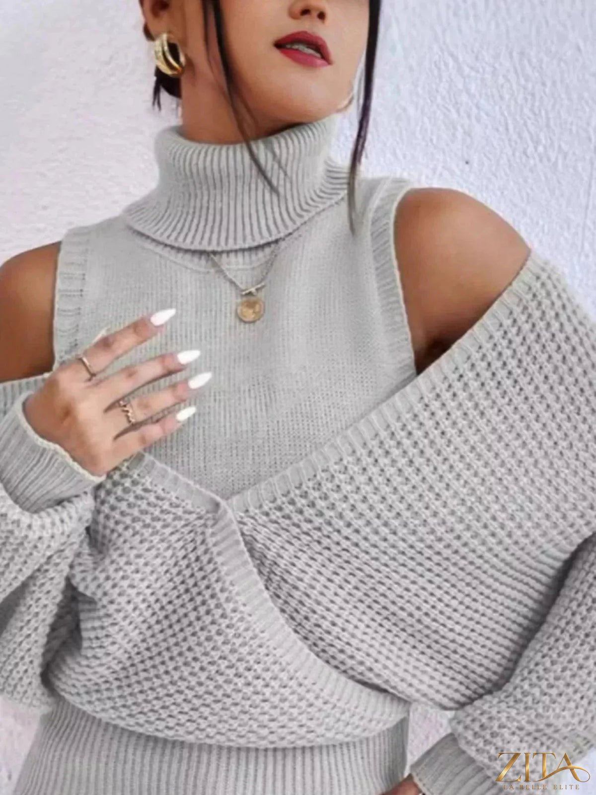 Waffle knit cold shoulder turtleneck sweater by Trendsi featuring a cozy, textured design with cut-out shoulders and a fitted silhouette.