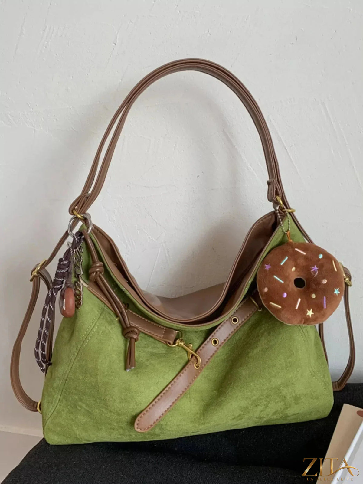 Zita La Belle Elite adjustable strap handbag with decorative charm, featuring stylish design and versatile carry options.