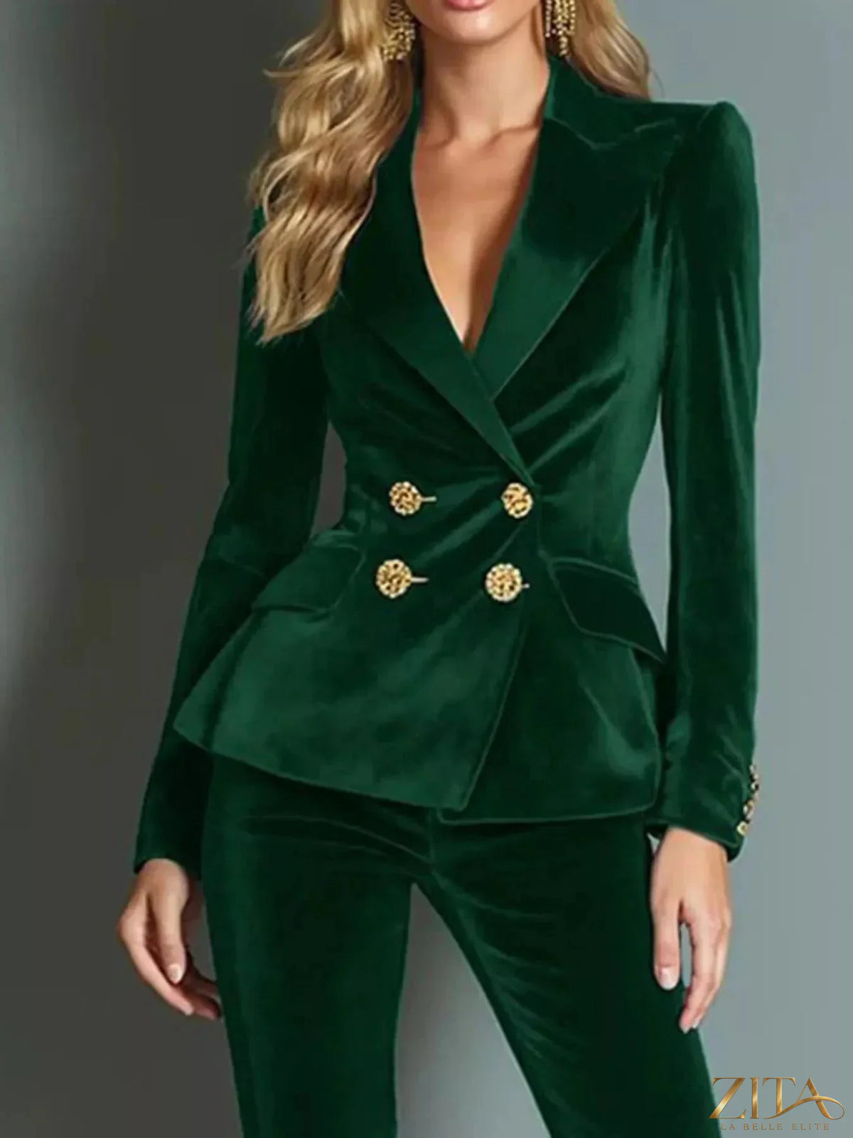 Zita La Belle Elite velvet double-breasted blazer and flared pants set, shown on a model with stylish accessories and a neutral background.